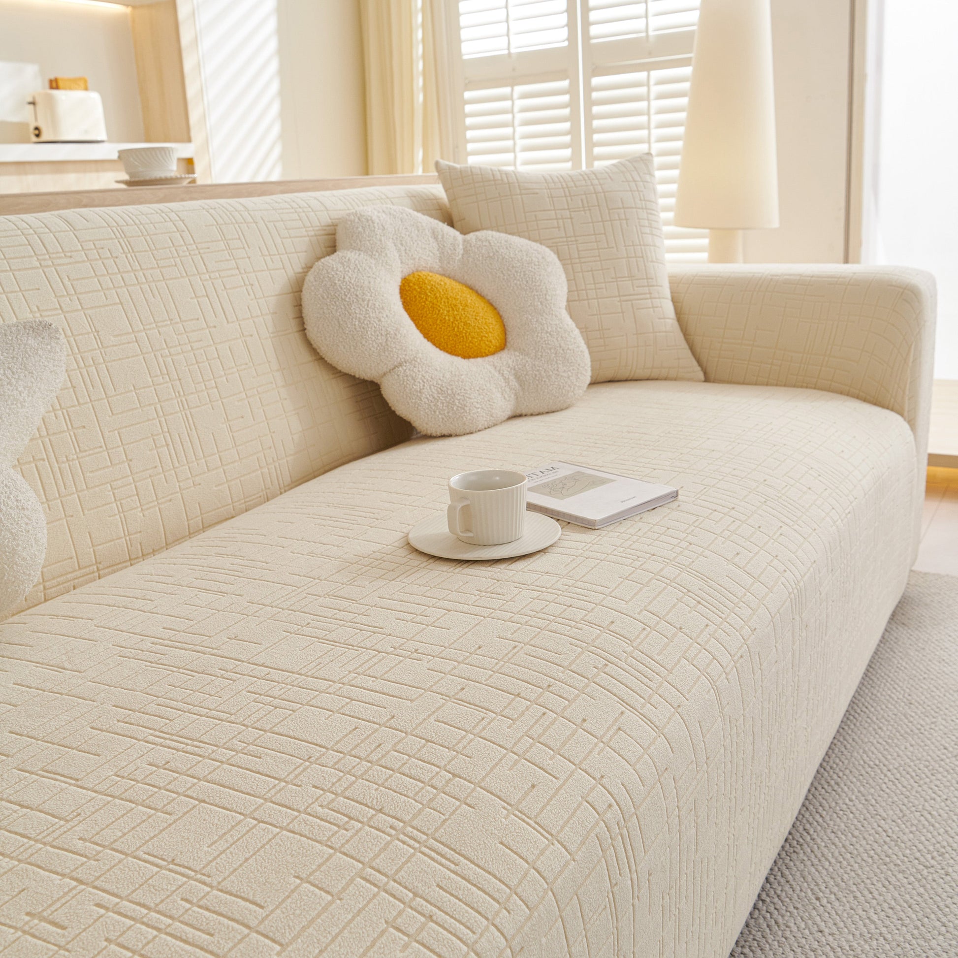 Embossed Lines Couch Covers Stretchable Non-Slip & Washable Sofa Slipcovers on a beige couch with decorative pillows.