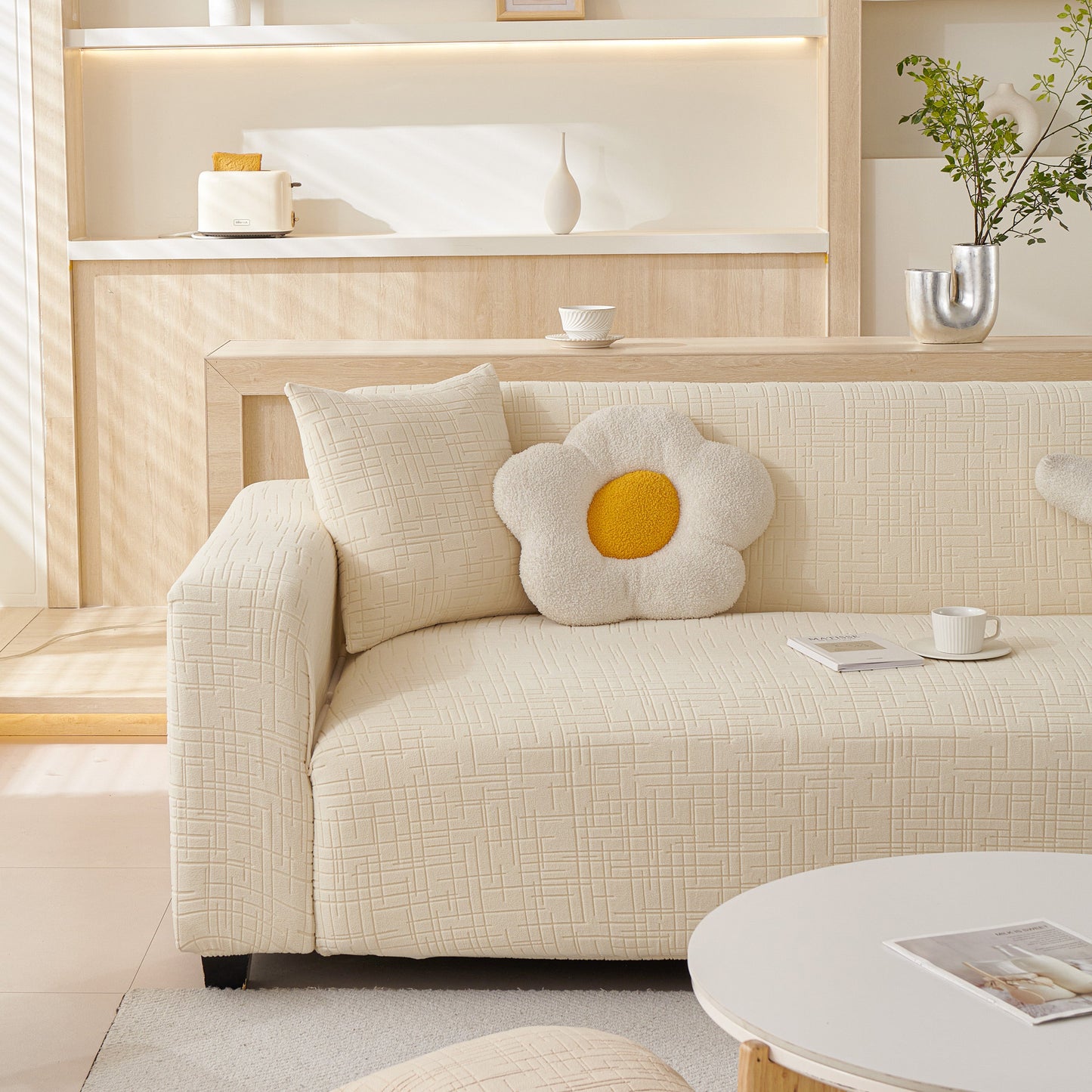 Embossed Lines Couch Covers Stretchable Non-Slip & Washable Sofa Slipcovers on a modern beige sofa with a floral cushion
