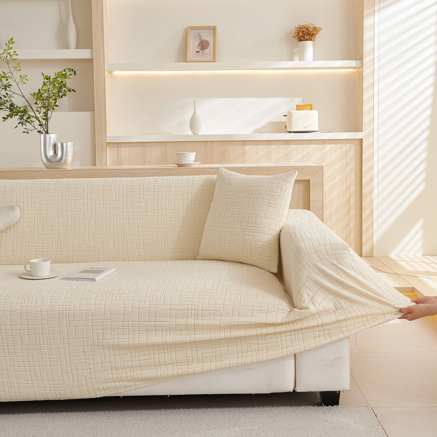 Embossed Lines Couch Covers Stretchable Non-Slip & Washable Sofa Slipcovers on a beige sofa in a cozy living room setting.