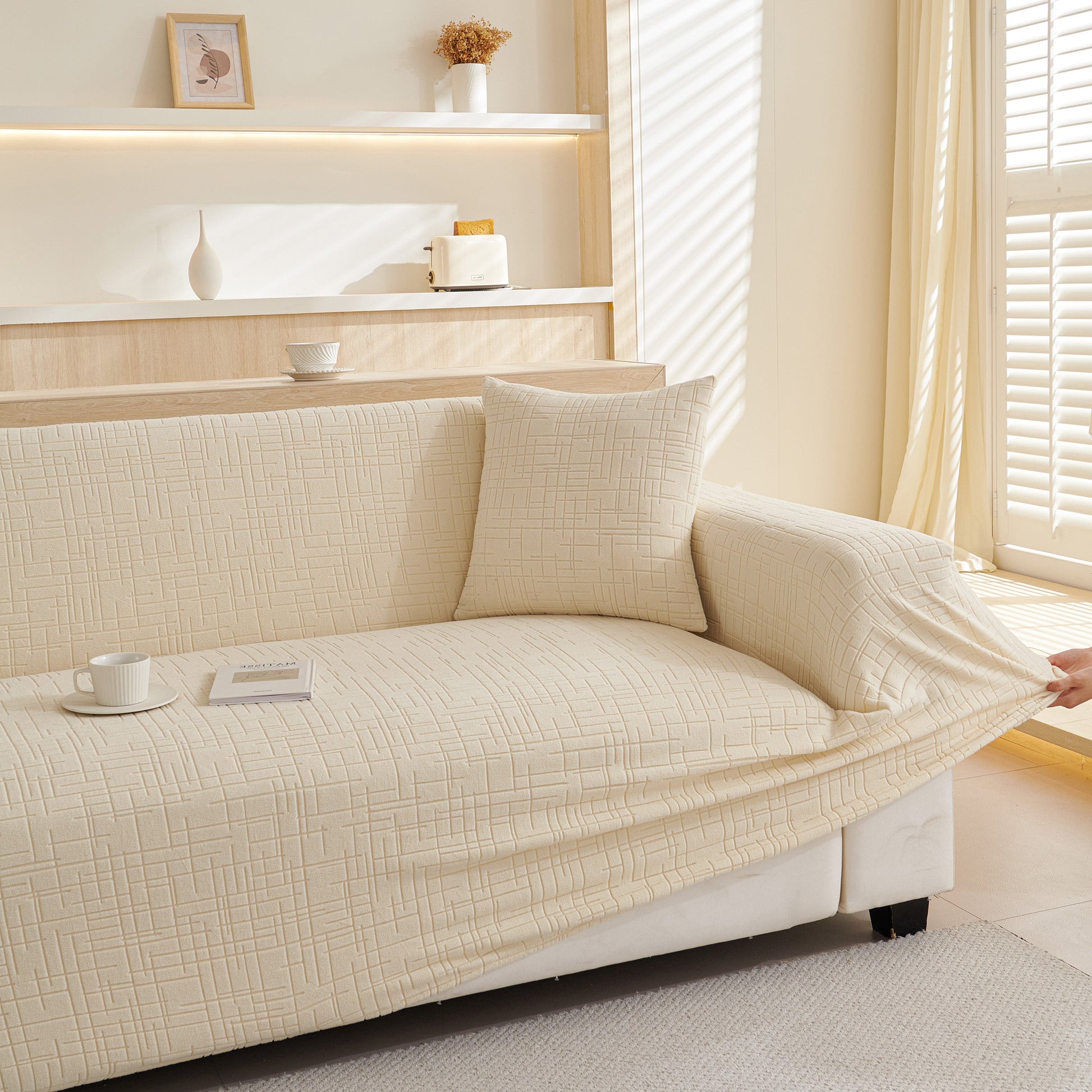 Beige Embossed Lines Couch Covers Stretchable Non-Slip & Washable Sofa Slipcovers on modern sofa in bright living room.