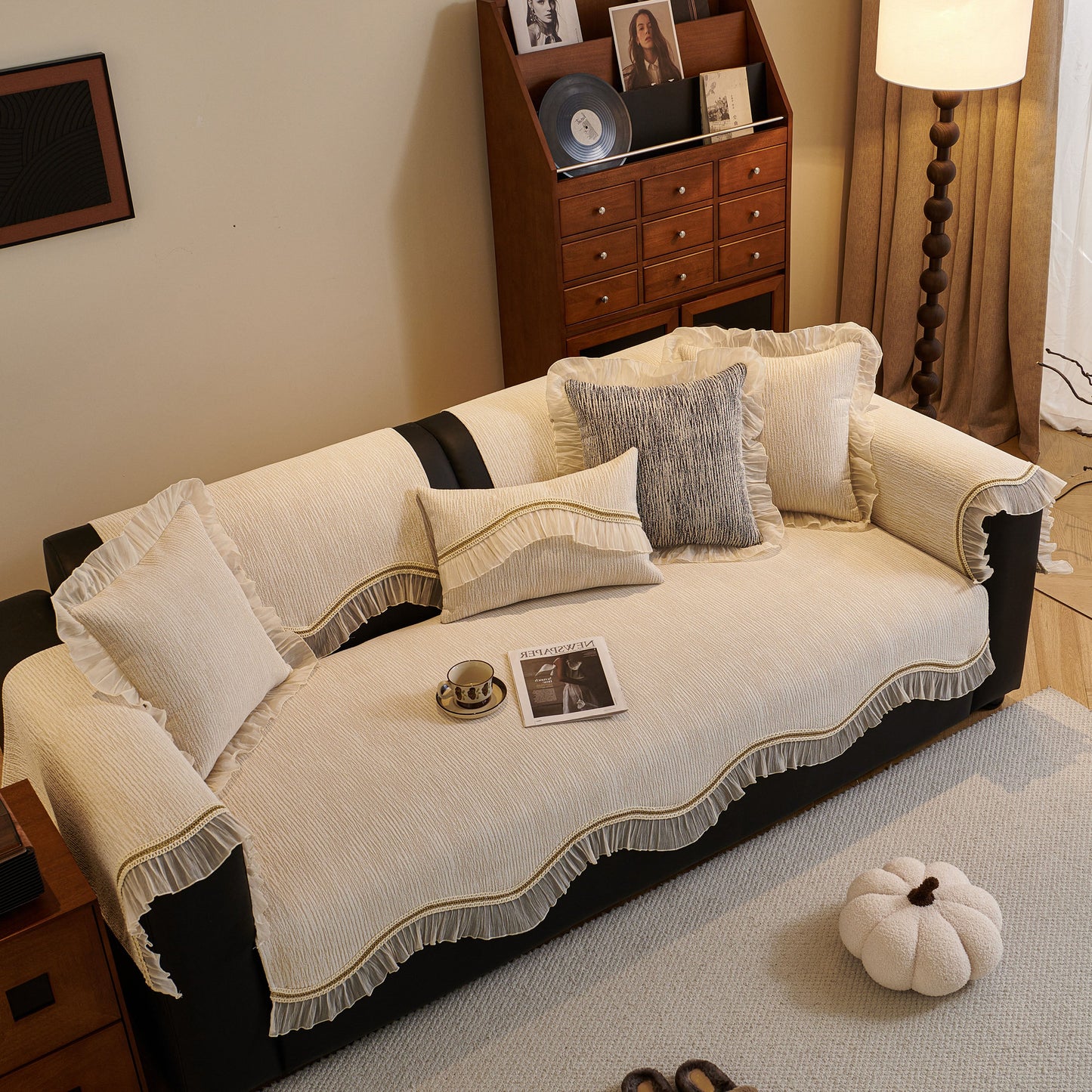 French Vintage Style Couch Cover with Skirt on a sofa with decorative pillows and non-slip features, enhancing elegance and comfort.