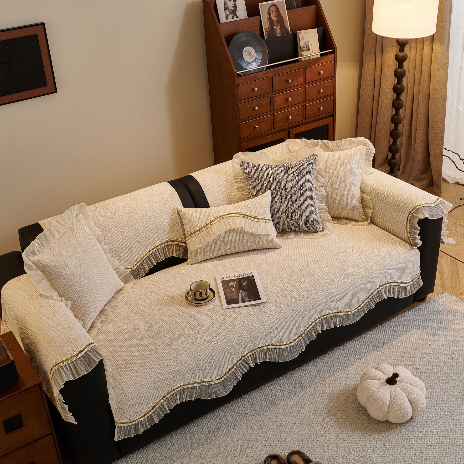 French Vintage Style Couch Cover with Skirt on a sofa with decorative pillows and non-slip features, enhancing elegance and comfort.