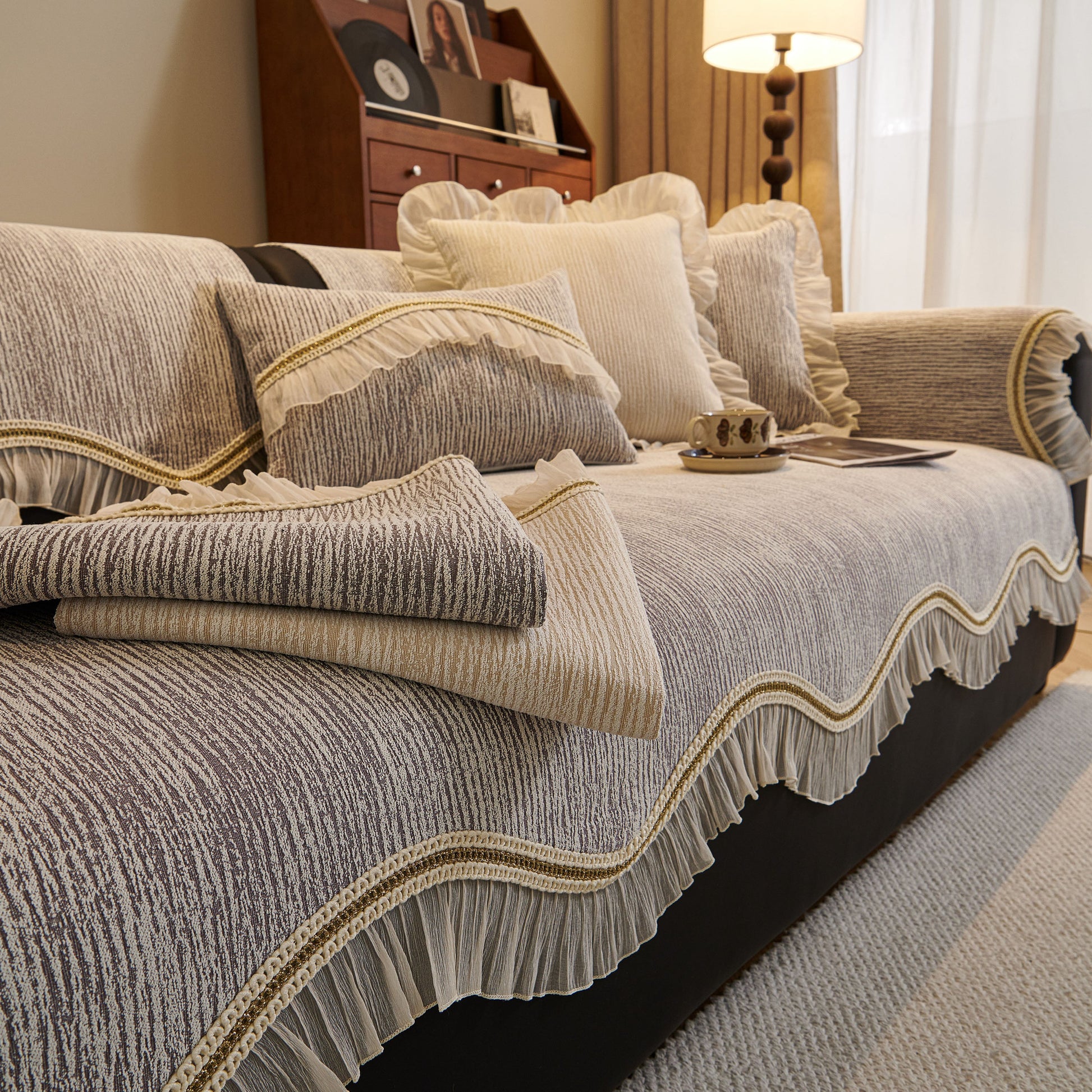 French Vintage Style Couch Cover with Skirt, Non-Slip Sectional Furniture Covers in gray chenille with gradient stripes and gold trim.