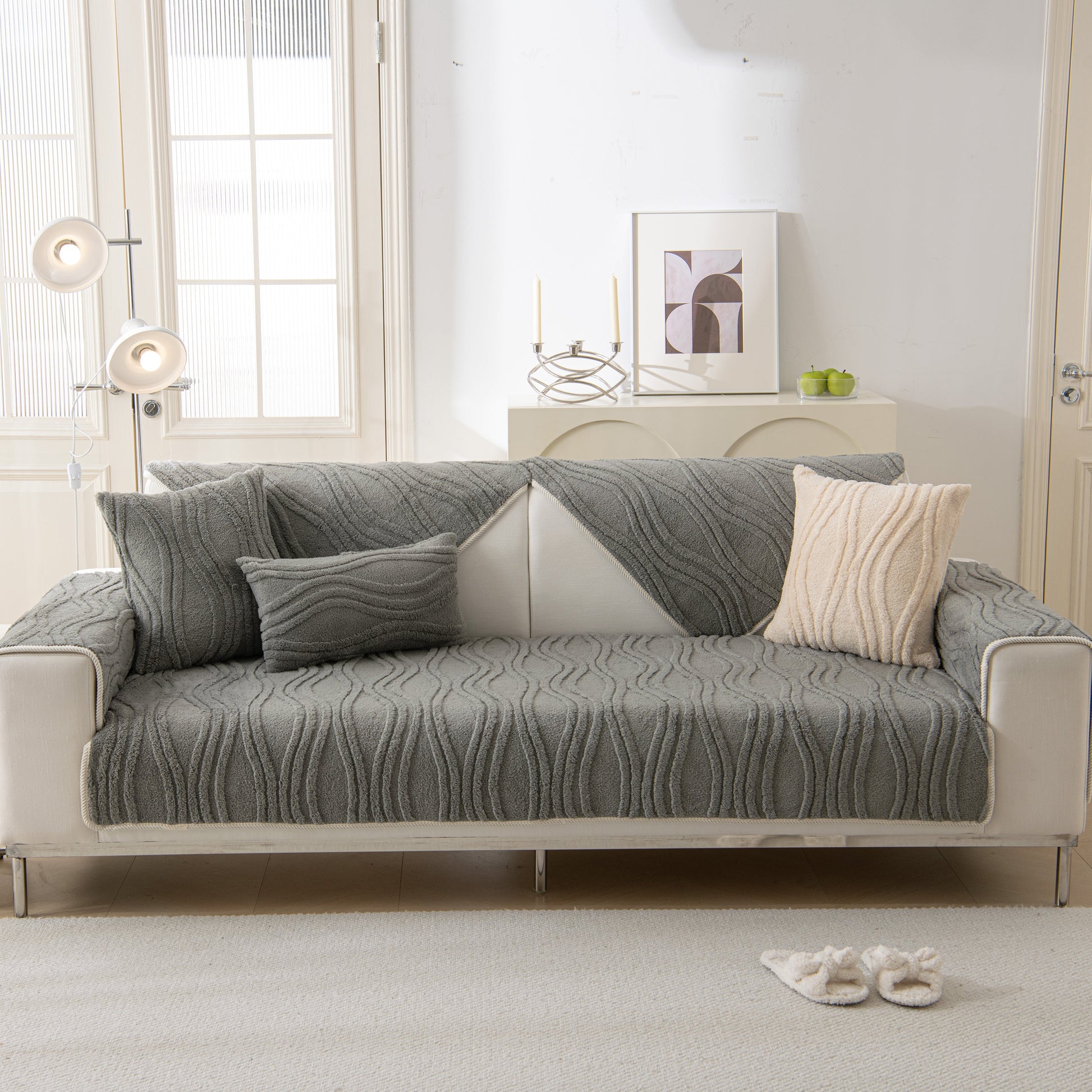 Elegant living room with Winter Thickened Non-slip Blanket, Three-Dimensional Embossed Cotton Velvet Sofa Cover on a modern sofa.
