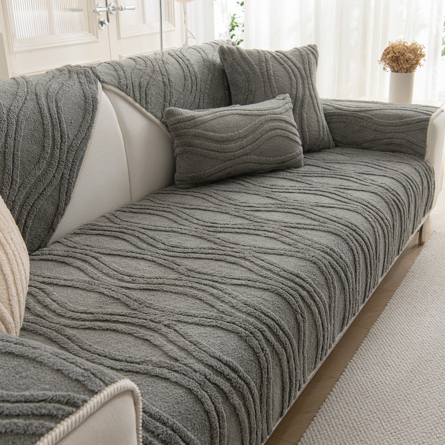 Winter Thickened Non-slip Blanket, Three-Dimensional Embossed Cotton Velvet Sofa Cover in gray plush texture on a cozy living room sofa.