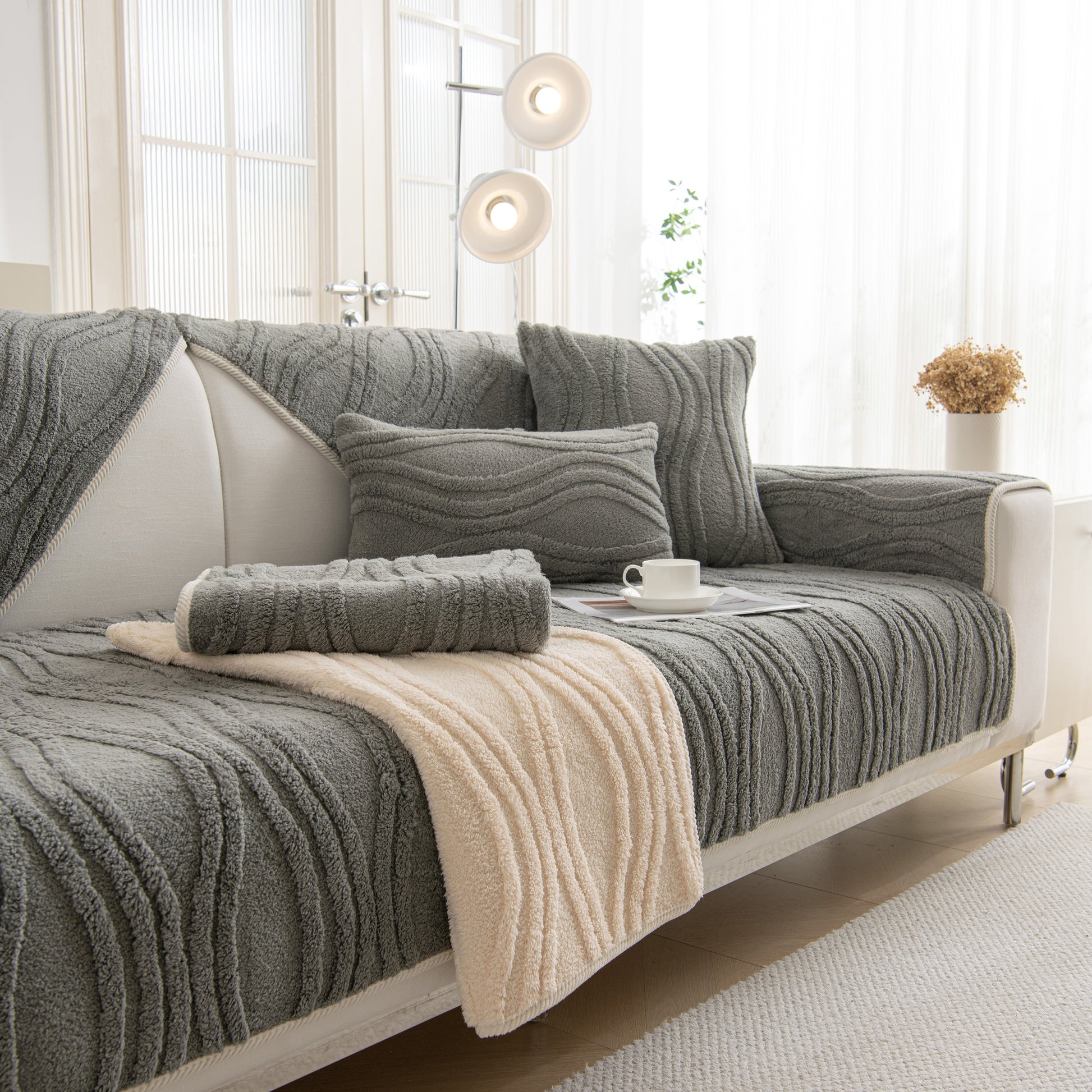 Winter Thickened Non-slip Blanket, Three-Dimensional Embossed Cotton Velvet Sofa Cover on a modern sofa in a stylish living room.