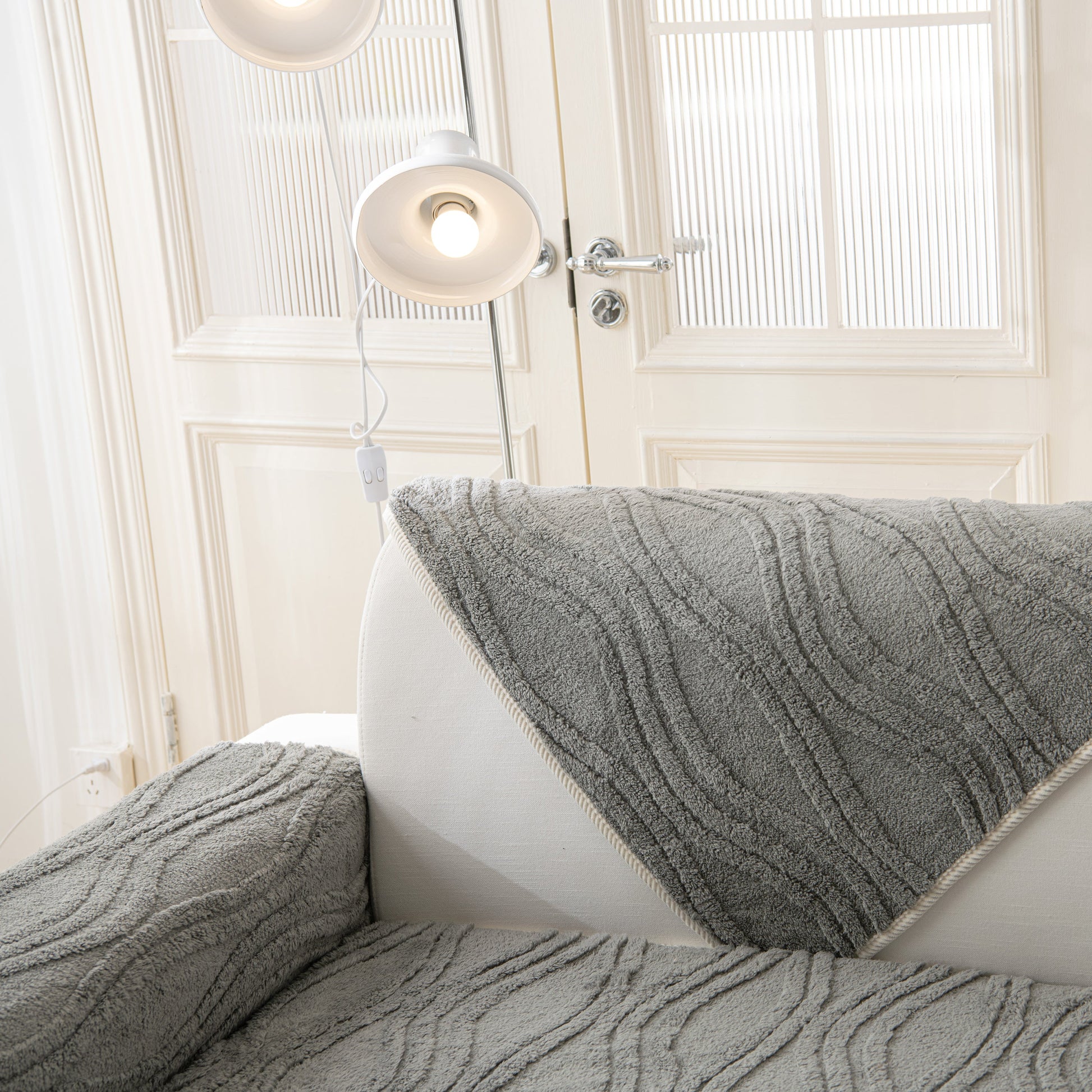 Winter Thickened Non-slip Blanket, Three-Dimensional Embossed Cotton Velvet Sofa Cover on white sofa, enhancing room decor.