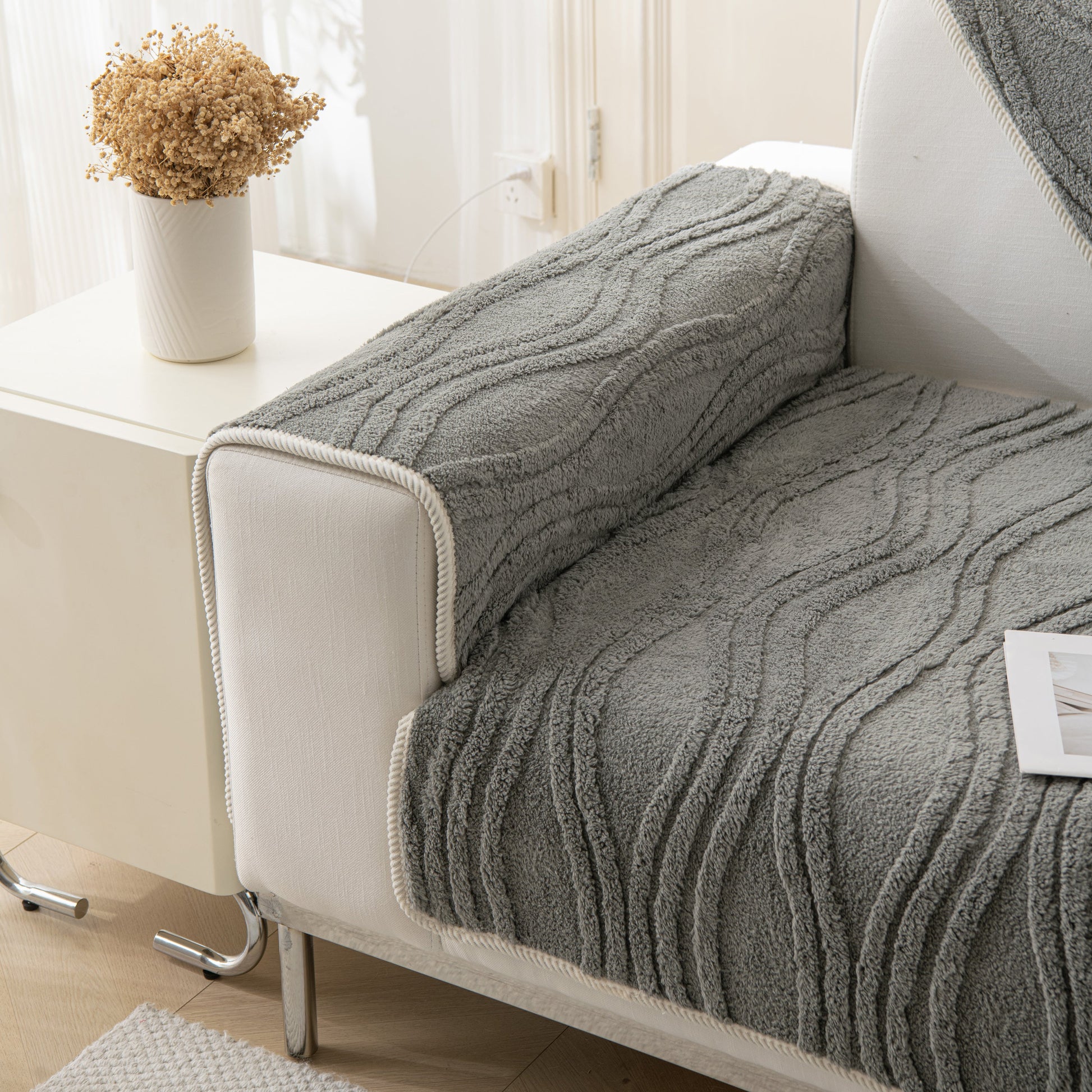 Winter Thickened Non-slip Blanket, Three-Dimensional Embossed Cotton Velvet Sofa Cover on a modern couch in a cozy living room.