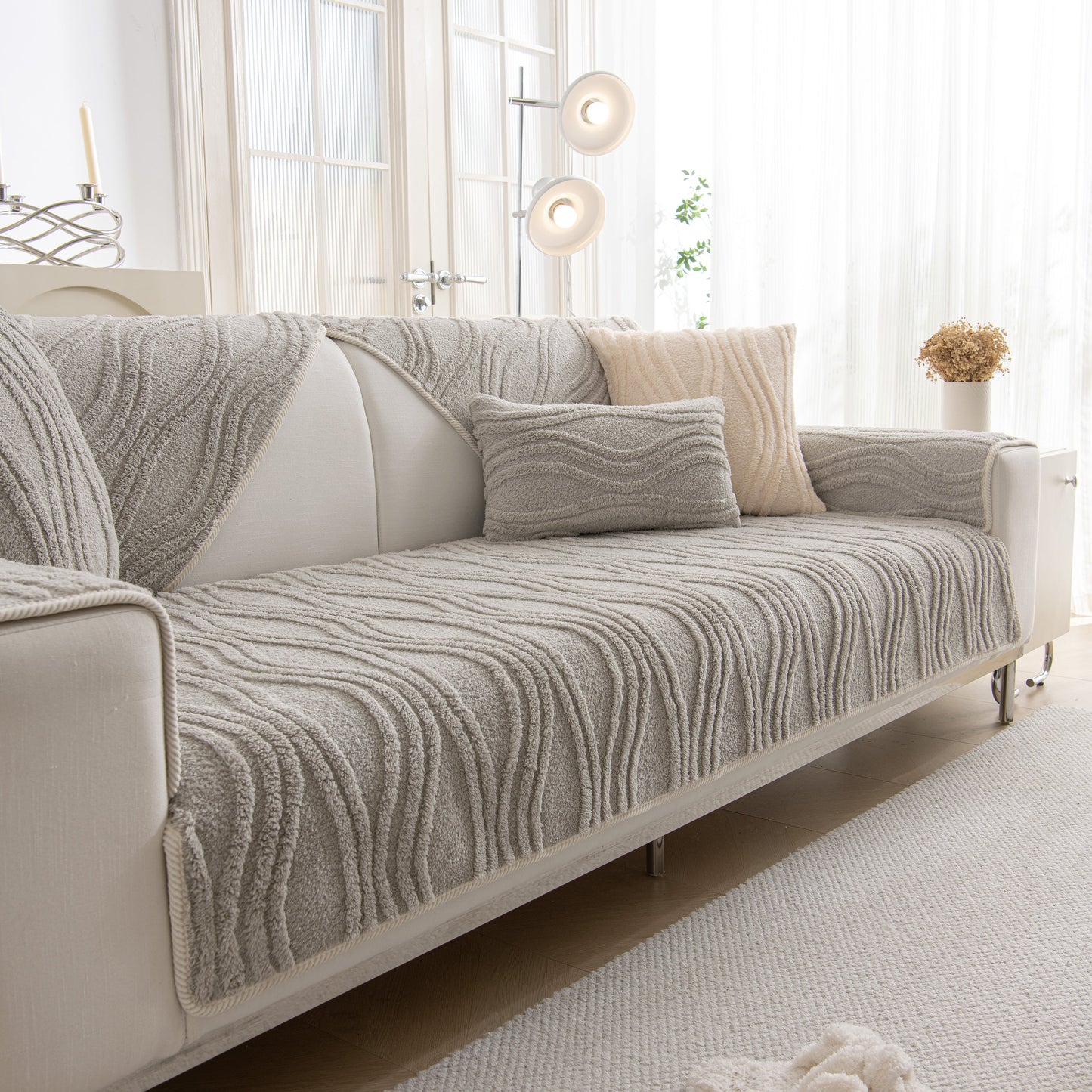 Winter Thickened Non-slip Blanket, Three-Dimensional Embossed Cotton Velvet Sofa Cover on a modern sofa, enhancing warmth and texture.