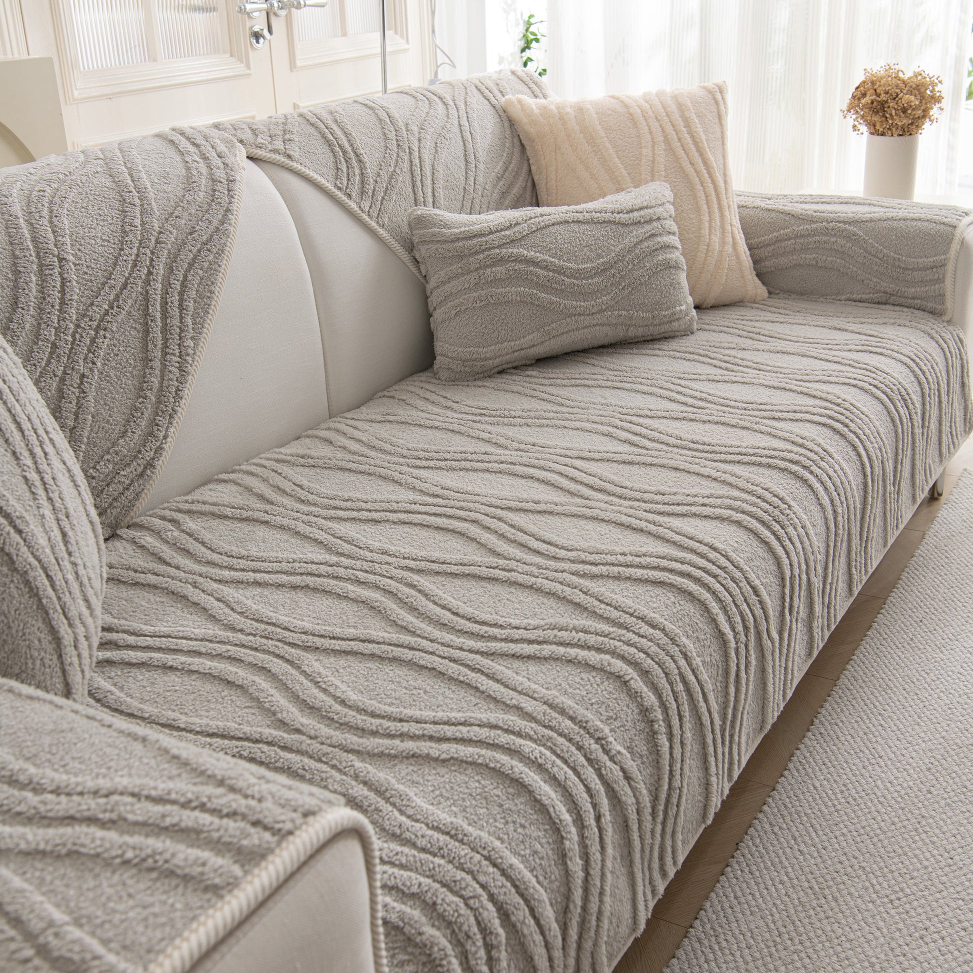 Winter Thickened Non-slip Blanket, Three-Dimensional Embossed Cotton Velvet Sofa Cover on a cozy couch in a bright room.