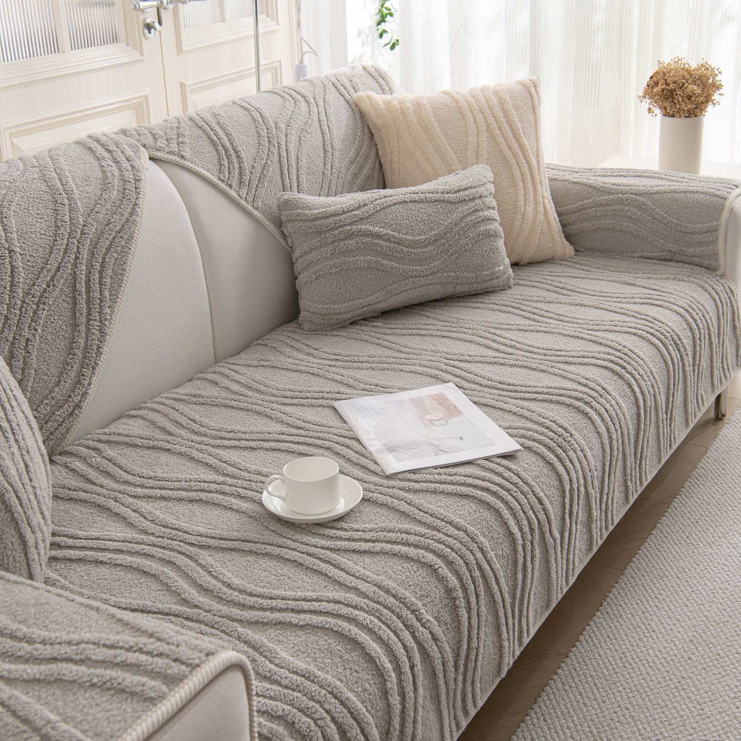 Winter Thickened Non-slip Blanket, Three-Dimensional Embossed Cotton Velvet Sofa Cover on a stylish grey sofa.