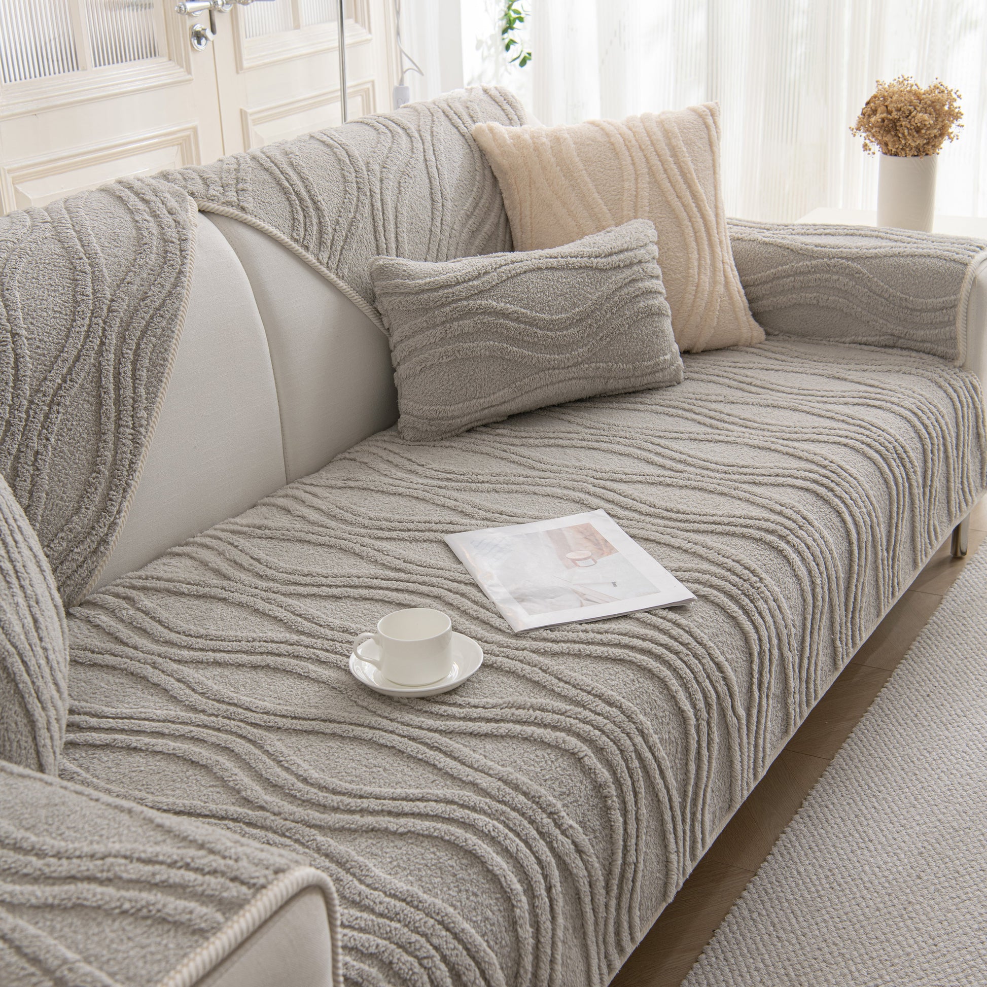 Winter Thickened Non-slip Blanket, Three-Dimensional Embossed Cotton Velvet Sofa Cover on a stylish grey sofa.