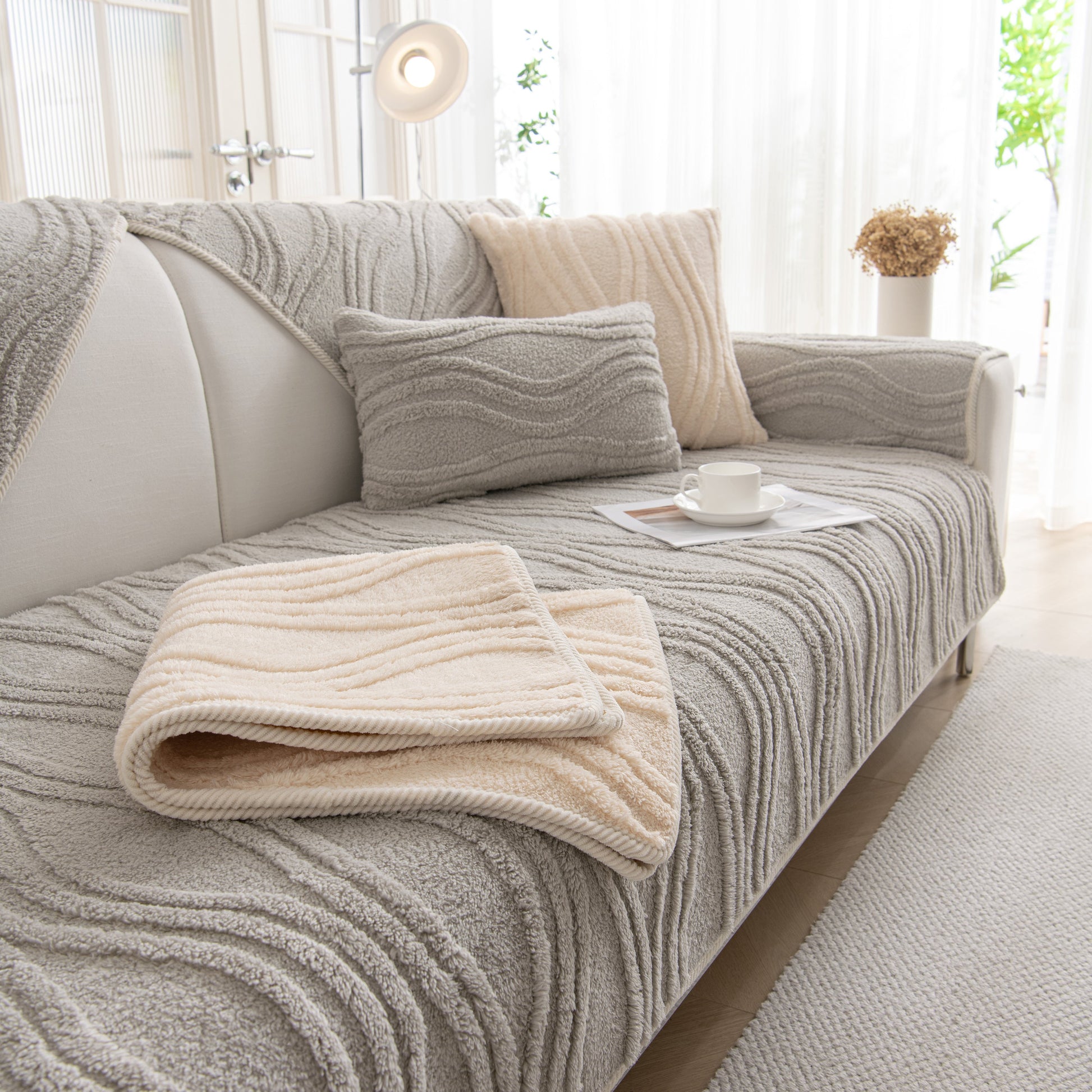 Winter Thickened Non-slip Blanket, Three-Dimensional Embossed Cotton Velvet Sofa Cover on a modern sofa.