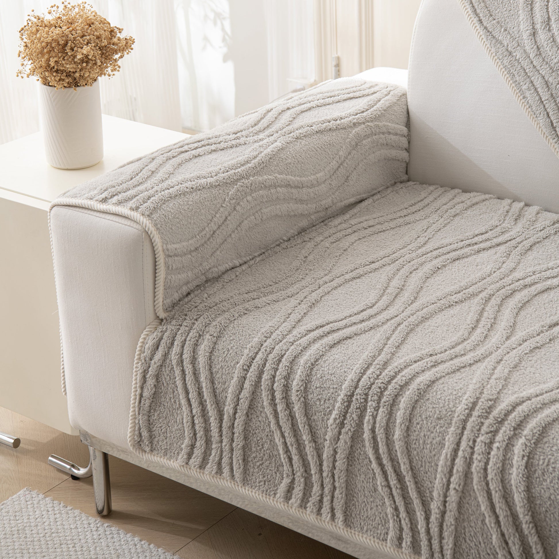 Winter Thickened Non-slip Blanket, Three-Dimensional Embossed Cotton Velvet Sofa Cover on a modern sofa.