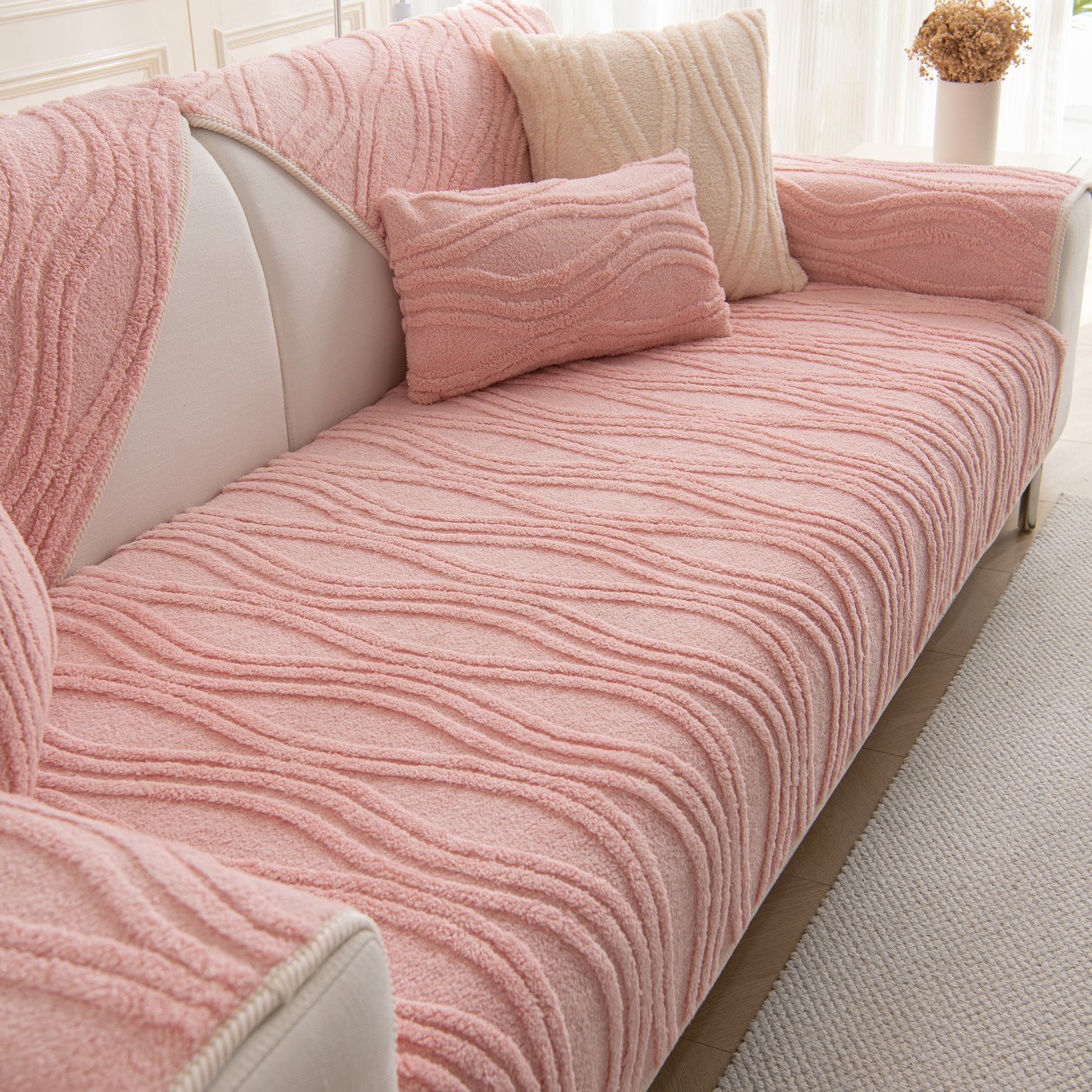Winter Thickened Non-slip Blanket, Three-Dimensional Embossed Cotton Velvet Sofa Cover in pink, enhancing a cozy living room space.