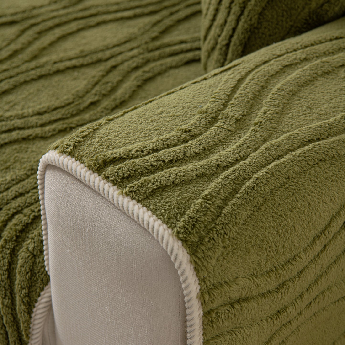 Close-up of Winter Thickened Non-slip Blanket, Three-Dimensional Embossed Cotton Velvet Sofa Cover in green with textured design.