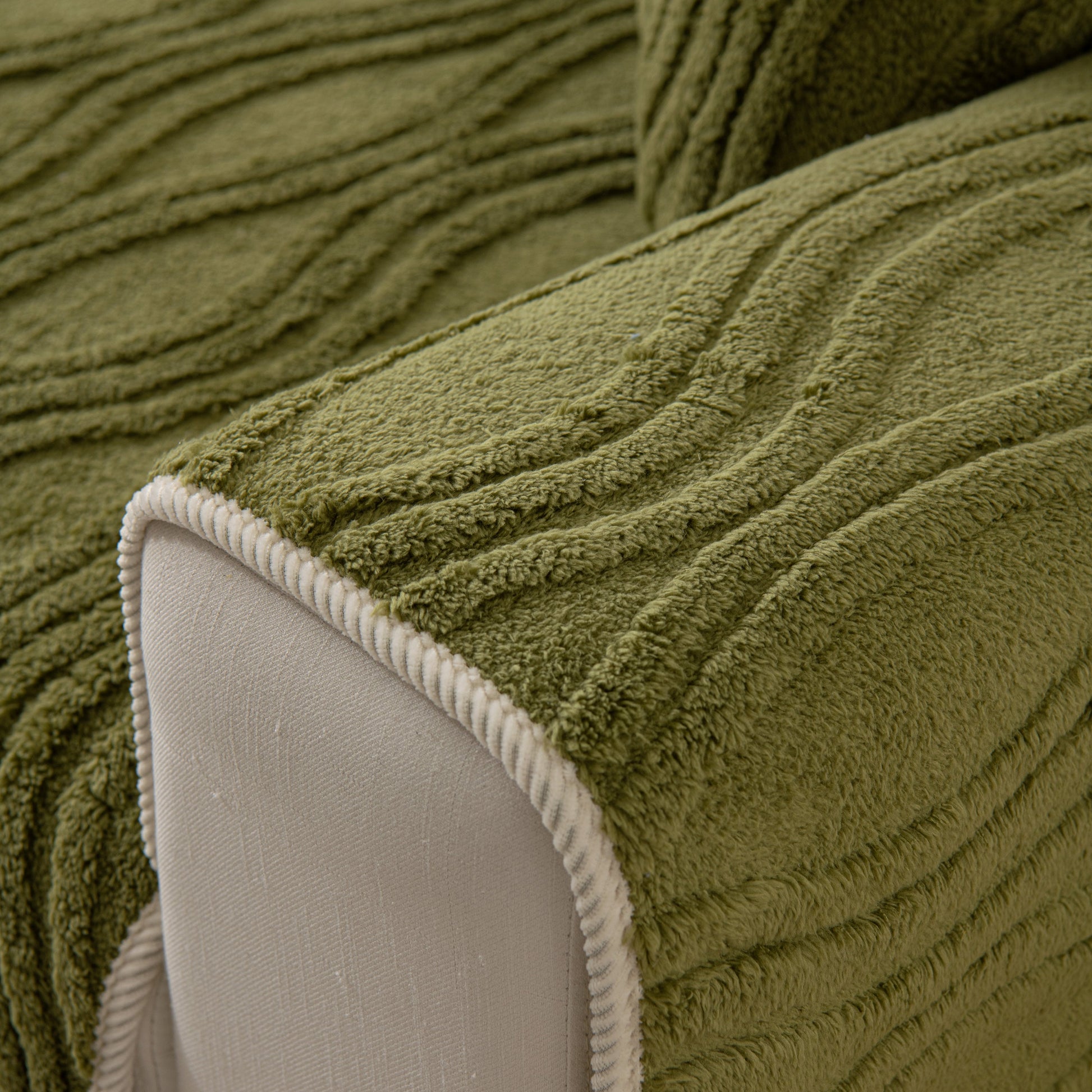 Close-up of Winter Thickened Non-slip Blanket, Three-Dimensional Embossed Cotton Velvet Sofa Cover in green with textured design.