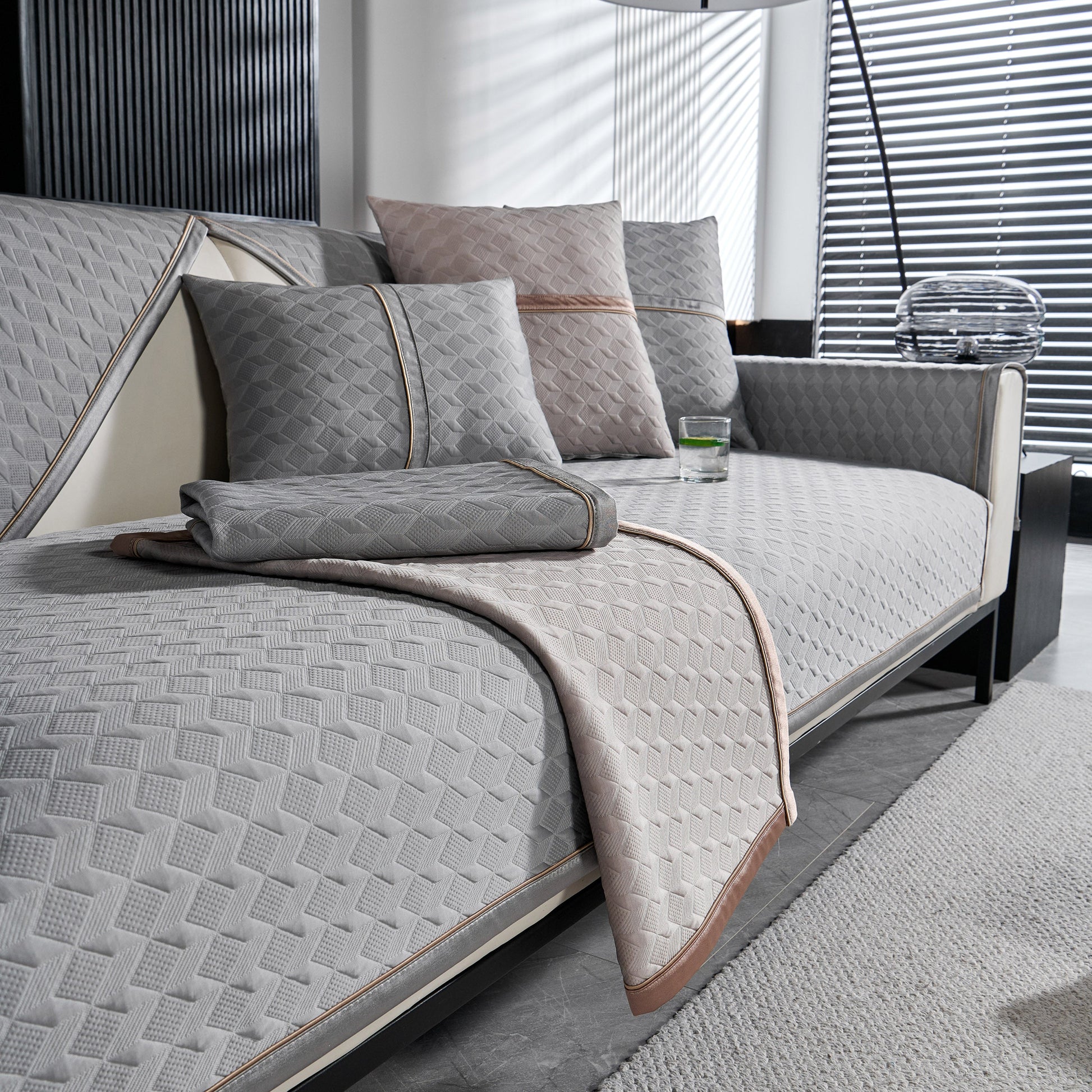 Geometric 3D Sofa Cover, Non-Slip Couch Protector for Seat, Backrest & Armrest featuring luxury diamond quilted design in modern living room.