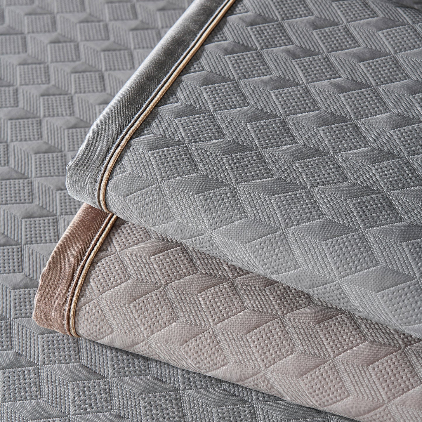Geometric 3D Sofa Cover, Non-Slip Couch Protector for Seat, Backrest & Armrest with diamond quilted pattern in grey and taupe.