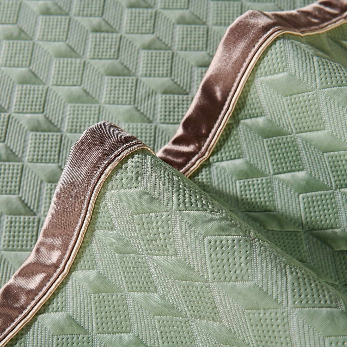Geometric 3D Sofa Cover, Non-Slip Couch Protector for Seat, Backrest & Armrest with diamond quilted design in close-up view.