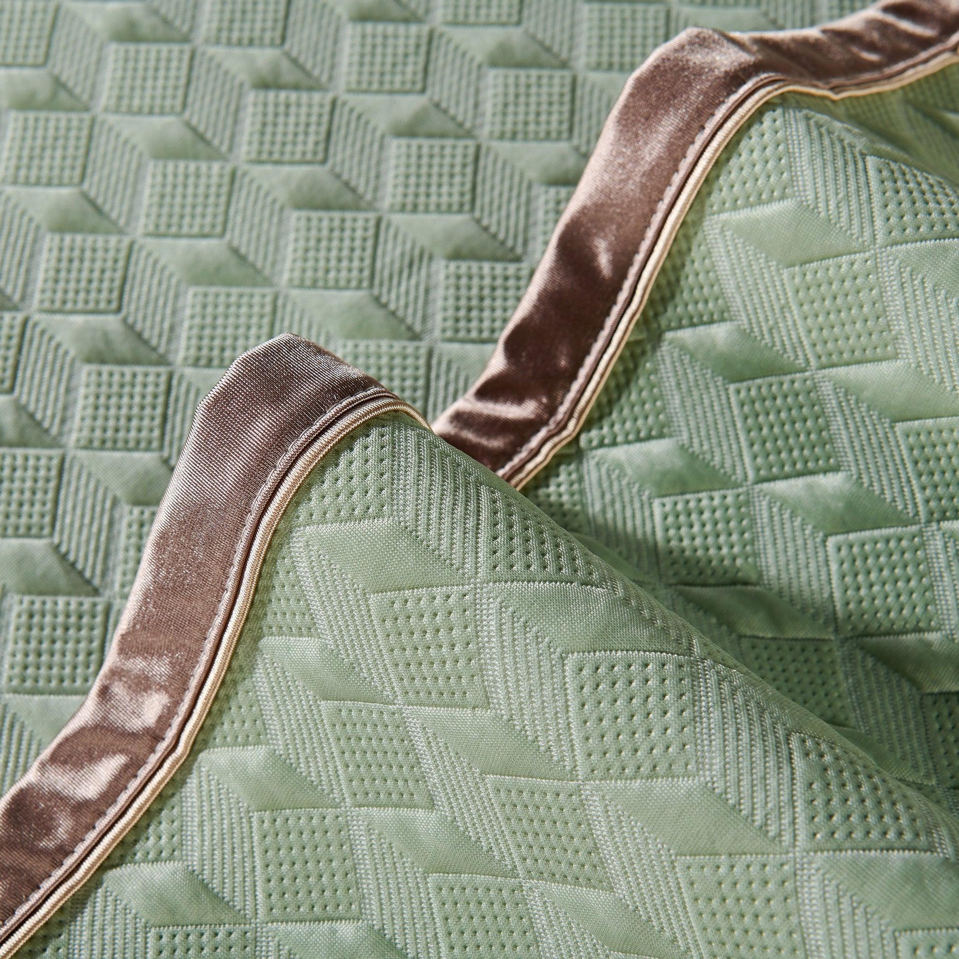 Geometric 3D Sofa Cover, Non-Slip Couch Protector for Seat, Backrest & Armrest with diamond quilted design in close-up view.