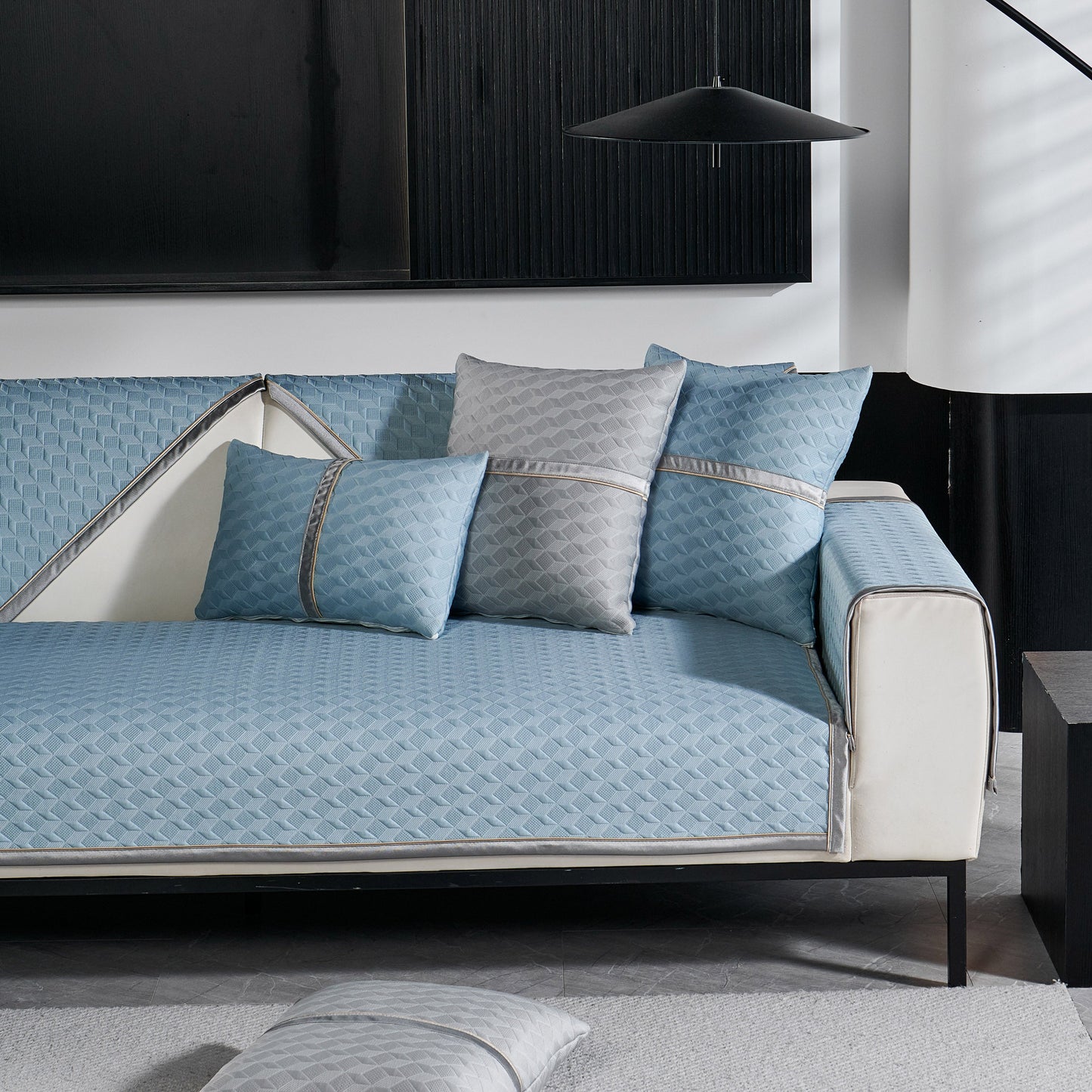Geometric 3D Sofa Cover, Non-Slip Couch Protector for Seat, Backrest & Armrest on a modern white and blue sofa with cushions