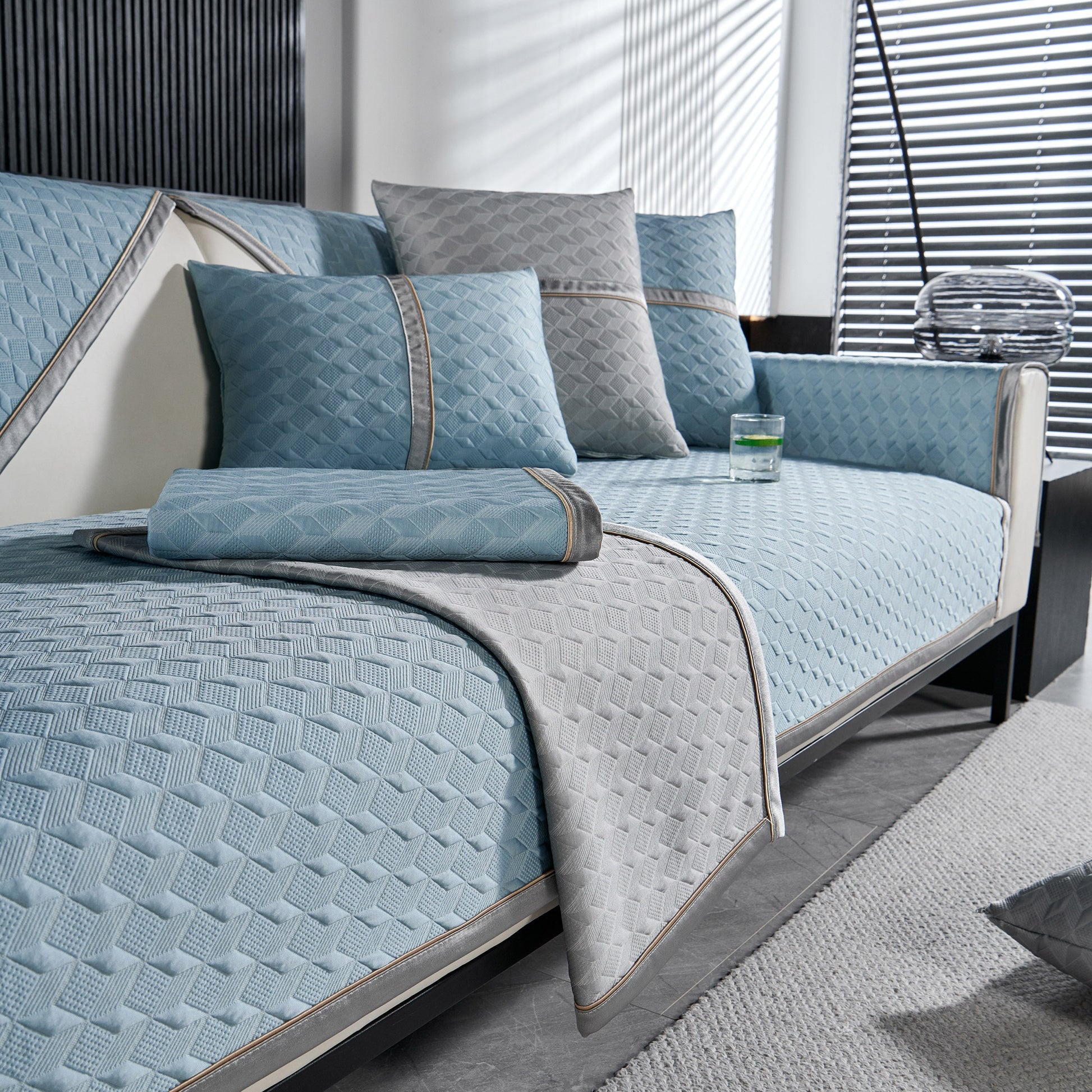 Geometric 3D Sofa Cover, Non-Slip Couch Protector for Seat, Backrest & Armrest with quilted blue design in modern living room