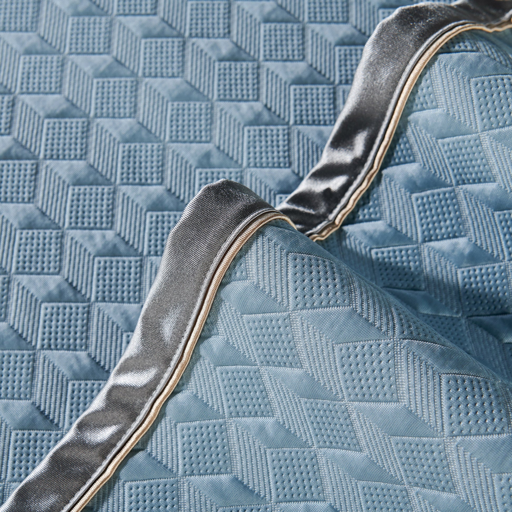Close-up of Geometric 3D Sofa Cover, Non-Slip Couch Protector for Seat, Backrest & Armrest with diamond quilted pattern.