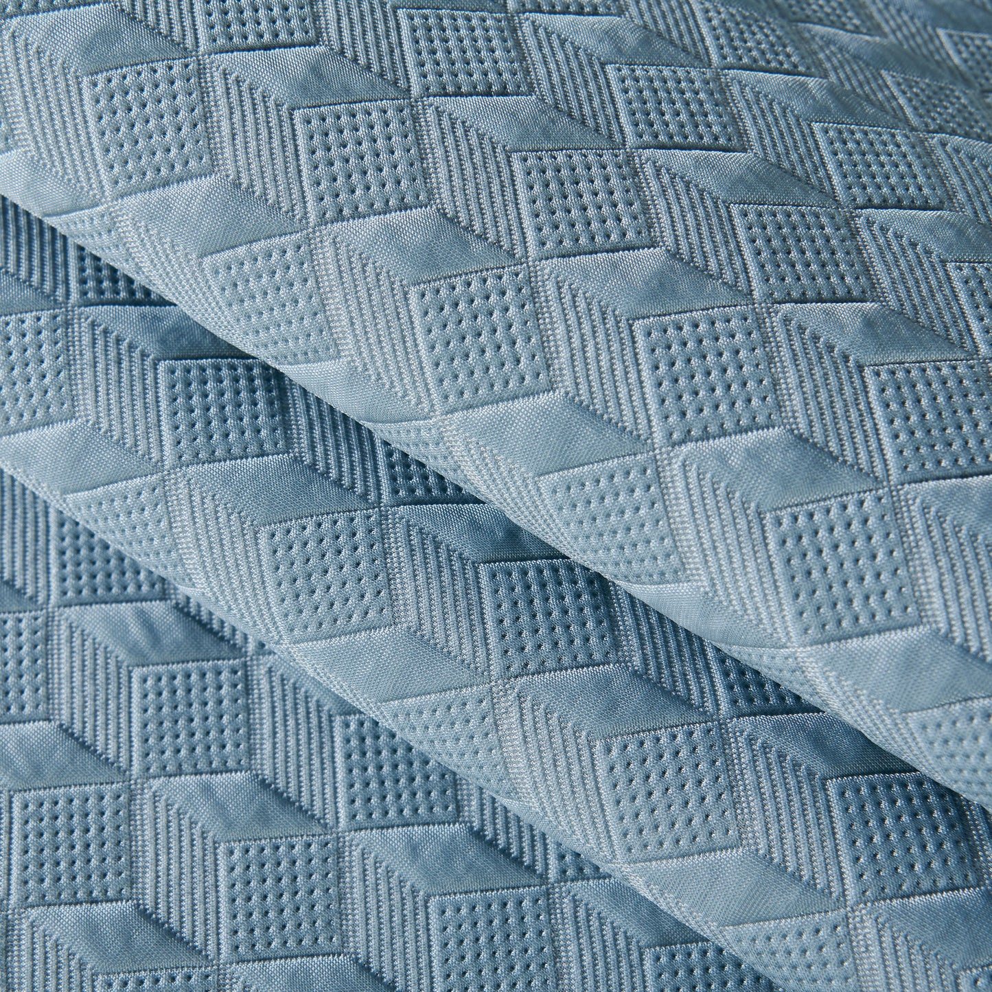 Close-up of Geometric 3D Sofa Cover, Non-Slip Couch Protector with diamond quilted texture for Seat, Backrest & Armrest.