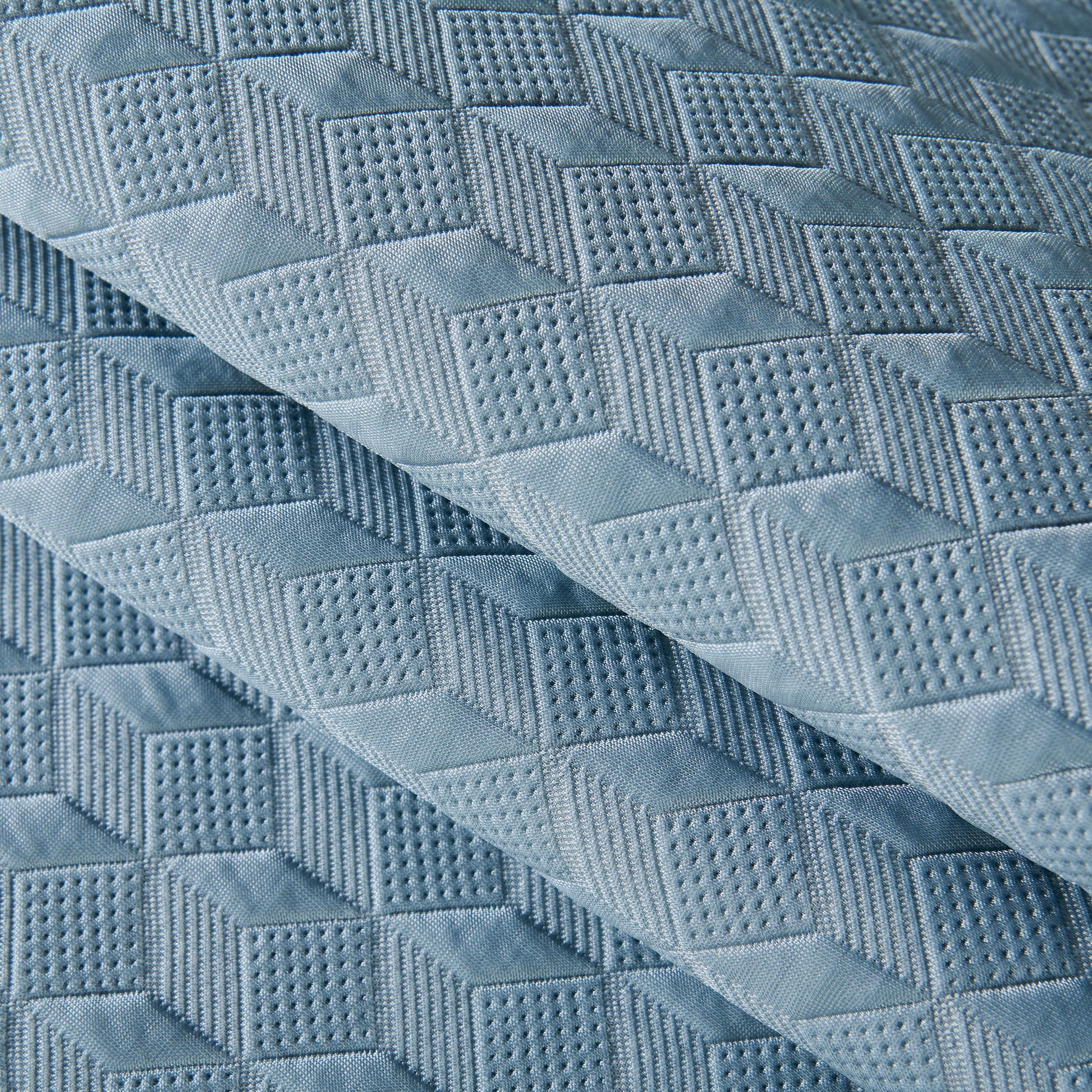 Close-up of Geometric 3D Sofa Cover, Non-Slip Couch Protector with diamond quilted texture for Seat, Backrest & Armrest.