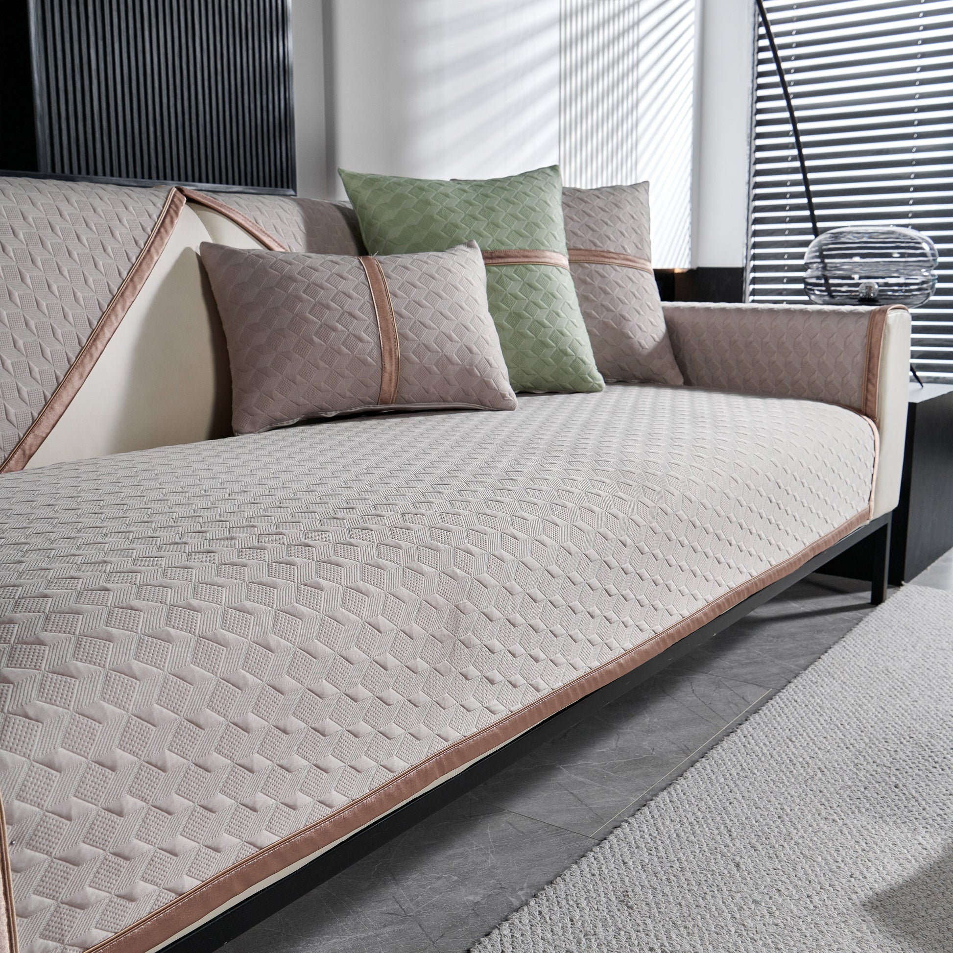 Geometric 3D Sofa Cover, Non-Slip Couch Protector for Seat, Backrest & Armrest with diamond quilted design on modern sofa.