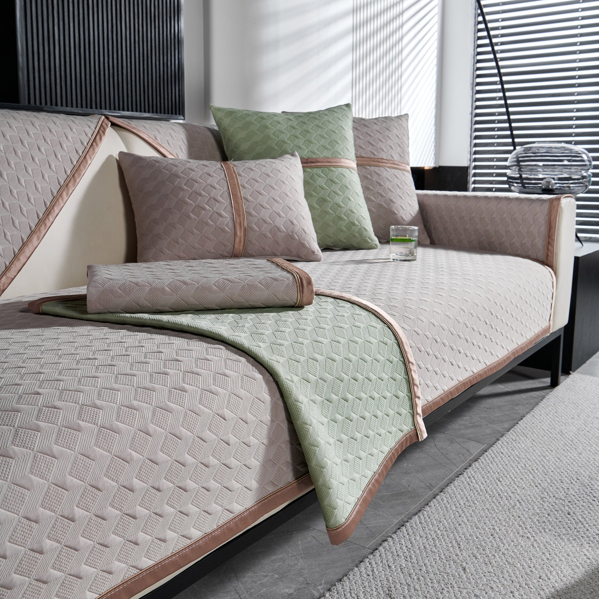 Geometric 3D Sofa Cover, Non-Slip Couch Protector for Seat, Backrest & Armrest featuring diamond quilted design on a living room sofa