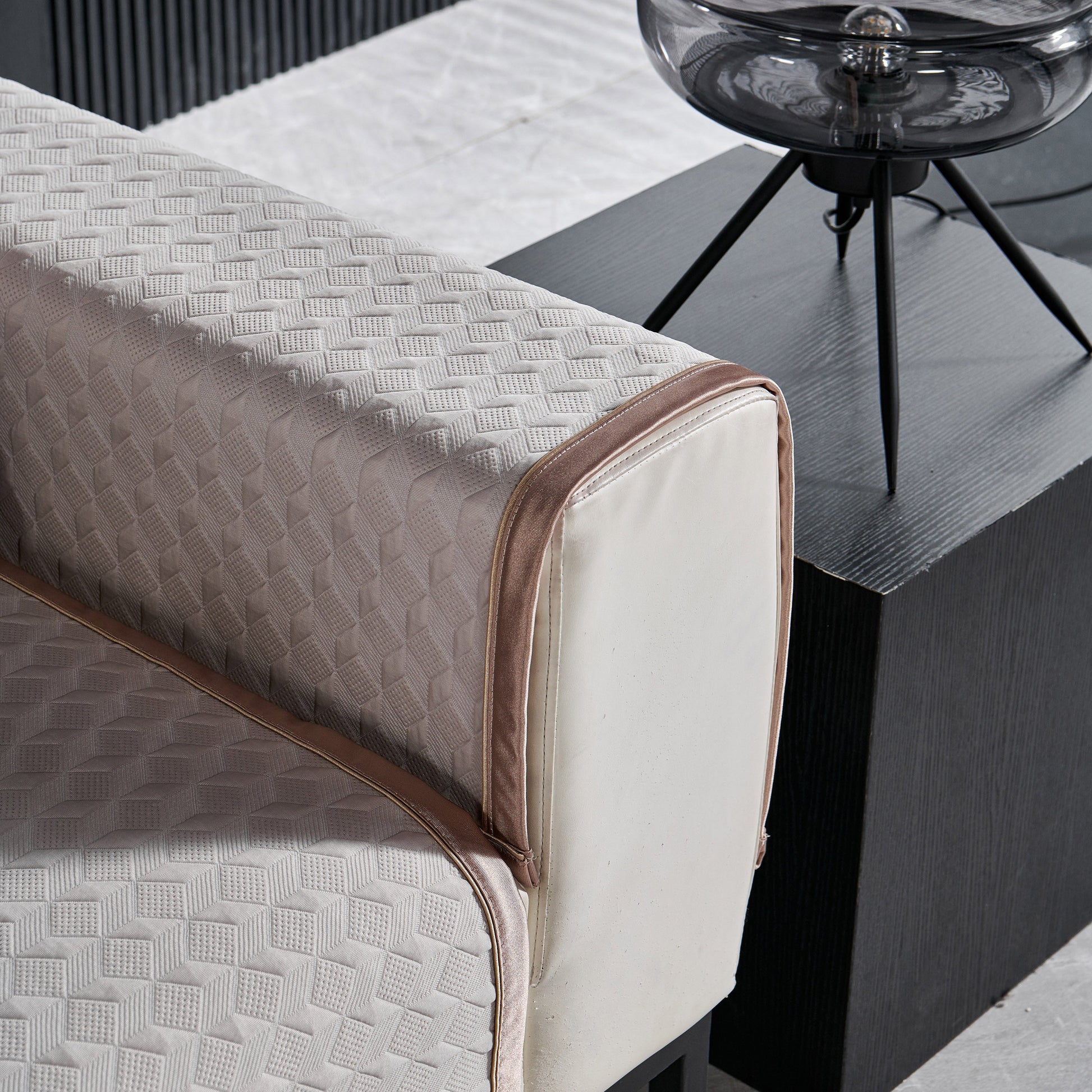 Geometric 3D Sofa Cover, Non-Slip Couch Protector for Seat, Backrest & Armrest with diamond quilted design on sofa armrest.