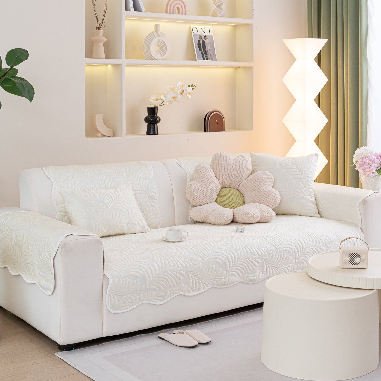 Sofa Cover for Leather & Fabric Couches, 3D Leaf Embossed Quilted Furniture Covers on a stylish modern white sofa.