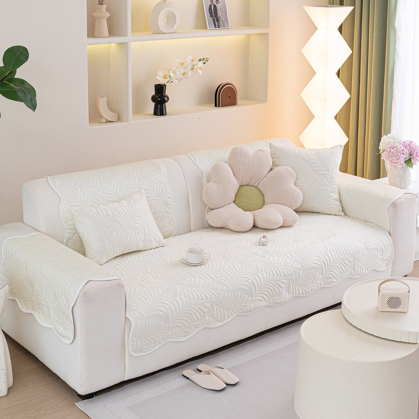 Sofa Cover for Leather & Fabric Couches, 3D Leaf Embossed Quilted Furniture Covers on a modern couch with floral decor.