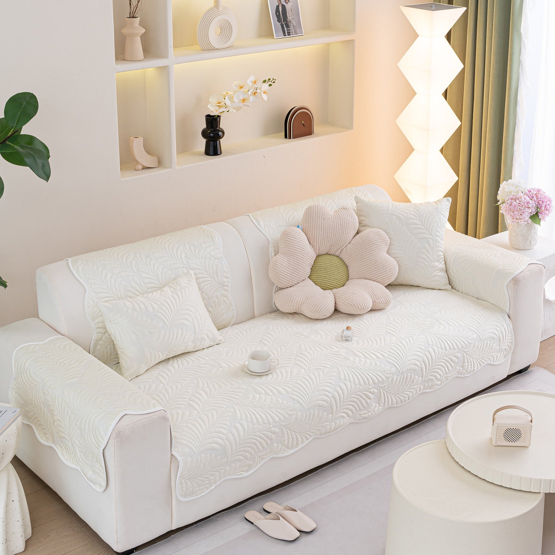 Sofa Cover for Leather & Fabric Couches, 3D Leaf Embossed Quilted Furniture Covers in a modern living room setting.