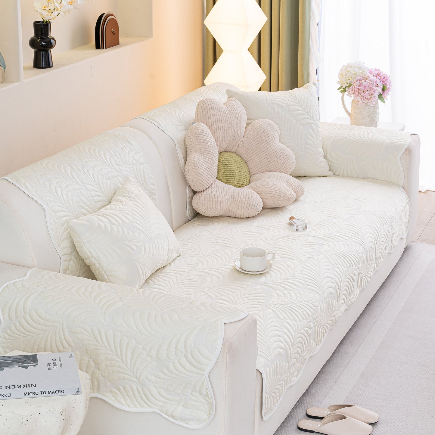 Sofa Cover for Leather & Fabric Couches, 3D Leaf Embossed Quilted Furniture Covers on white sofa with decorative pillows.