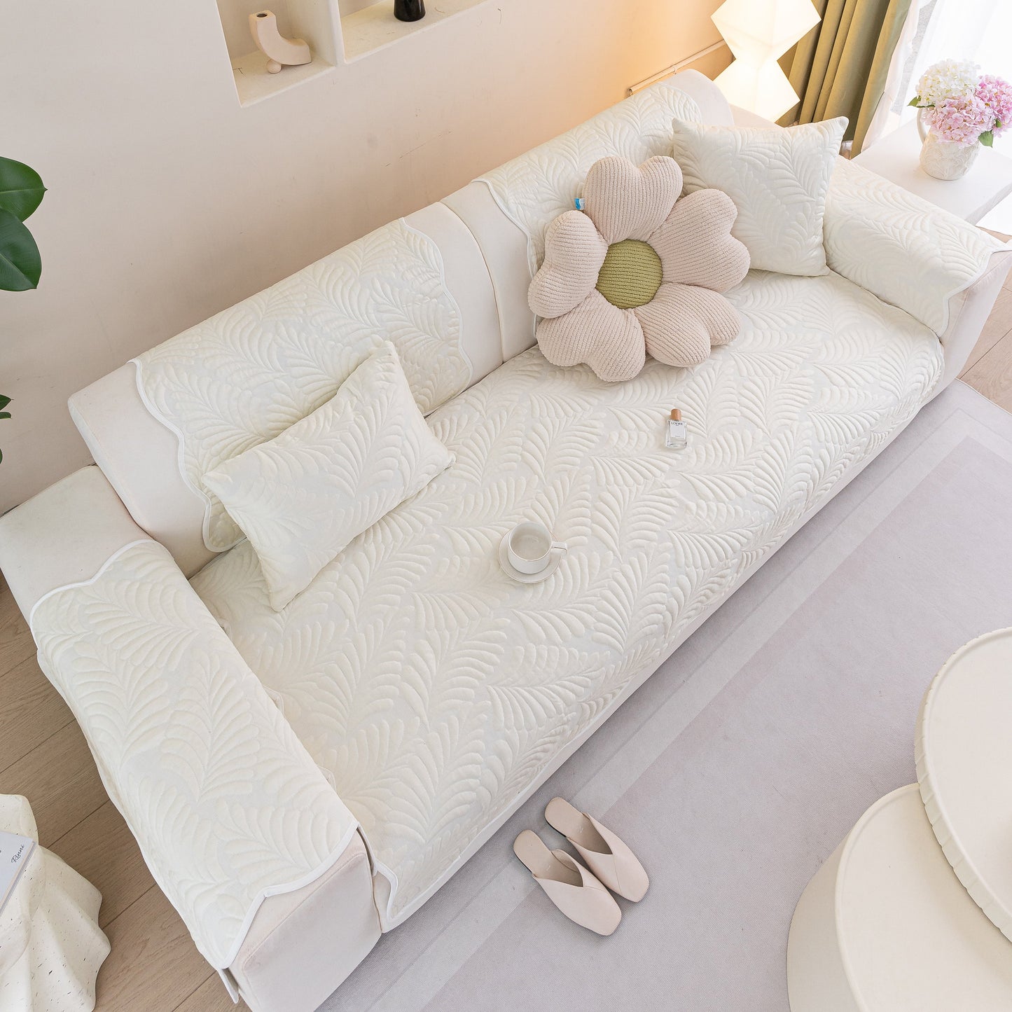 Sofa Cover for Leather & Fabric Couches, 3D Leaf Embossed Quilted Furniture Covers on white sofa with textured design.