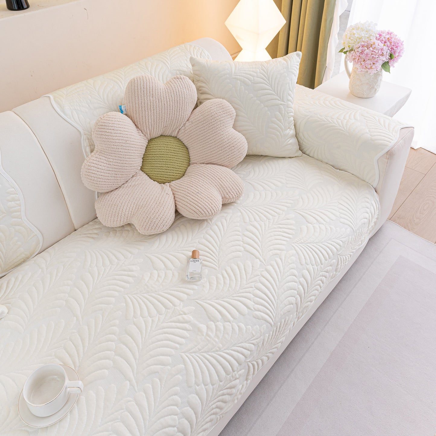 Sofa Cover for Leather & Fabric Couches, 3D Leaf Embossed Quilted Furniture Covers on cream couch with flower pillow.