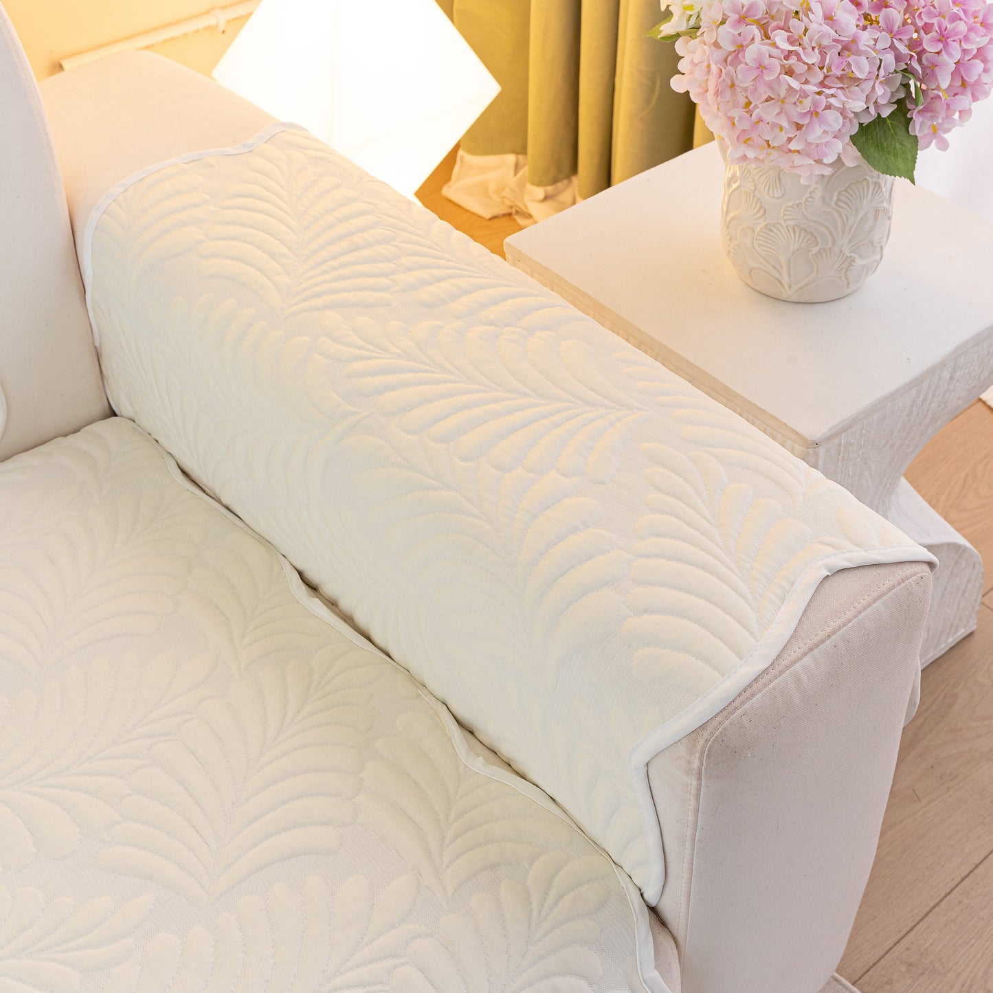 Sofa Cover for Leather & Fabric Couches, 3D Leaf Embossed Quilted Furniture Covers on a couch with wave-cut edges and non-slip backing