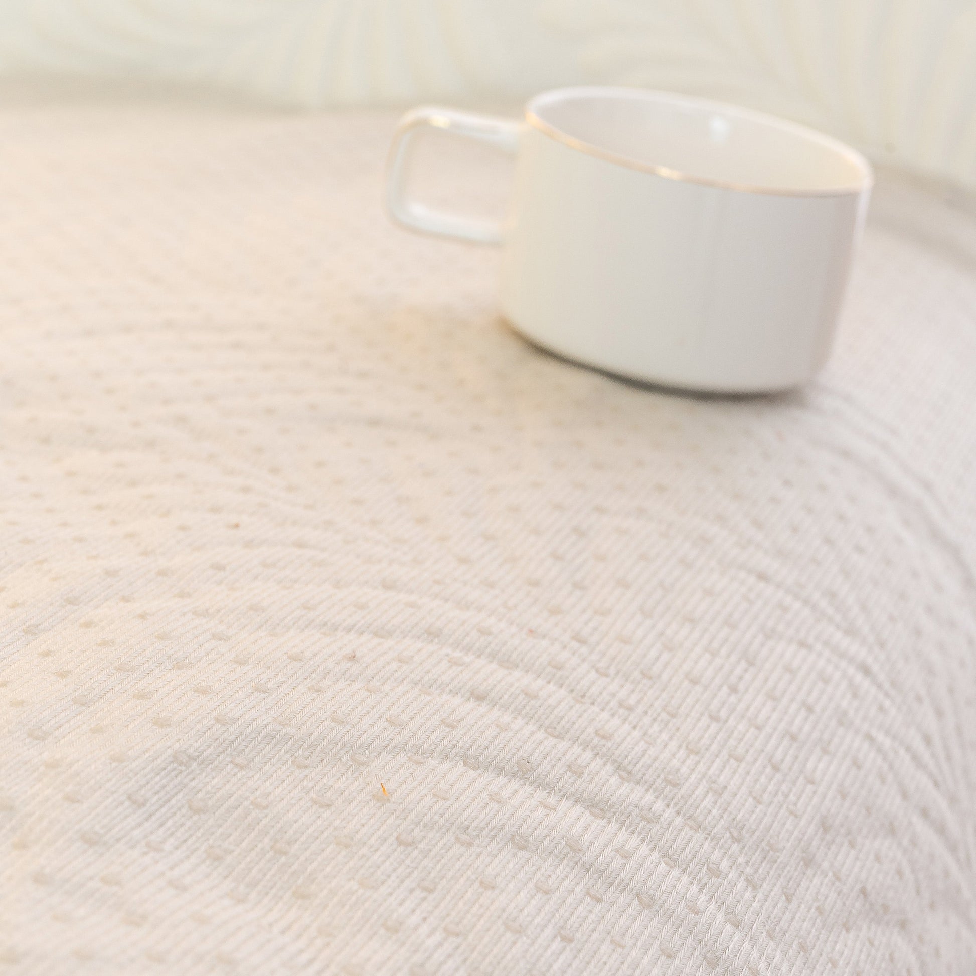 Sofa Cover for Leather & Fabric Couches, 3D Leaf Embossed Quilted Furniture Covers with anti-slip design, white cup resting on cover