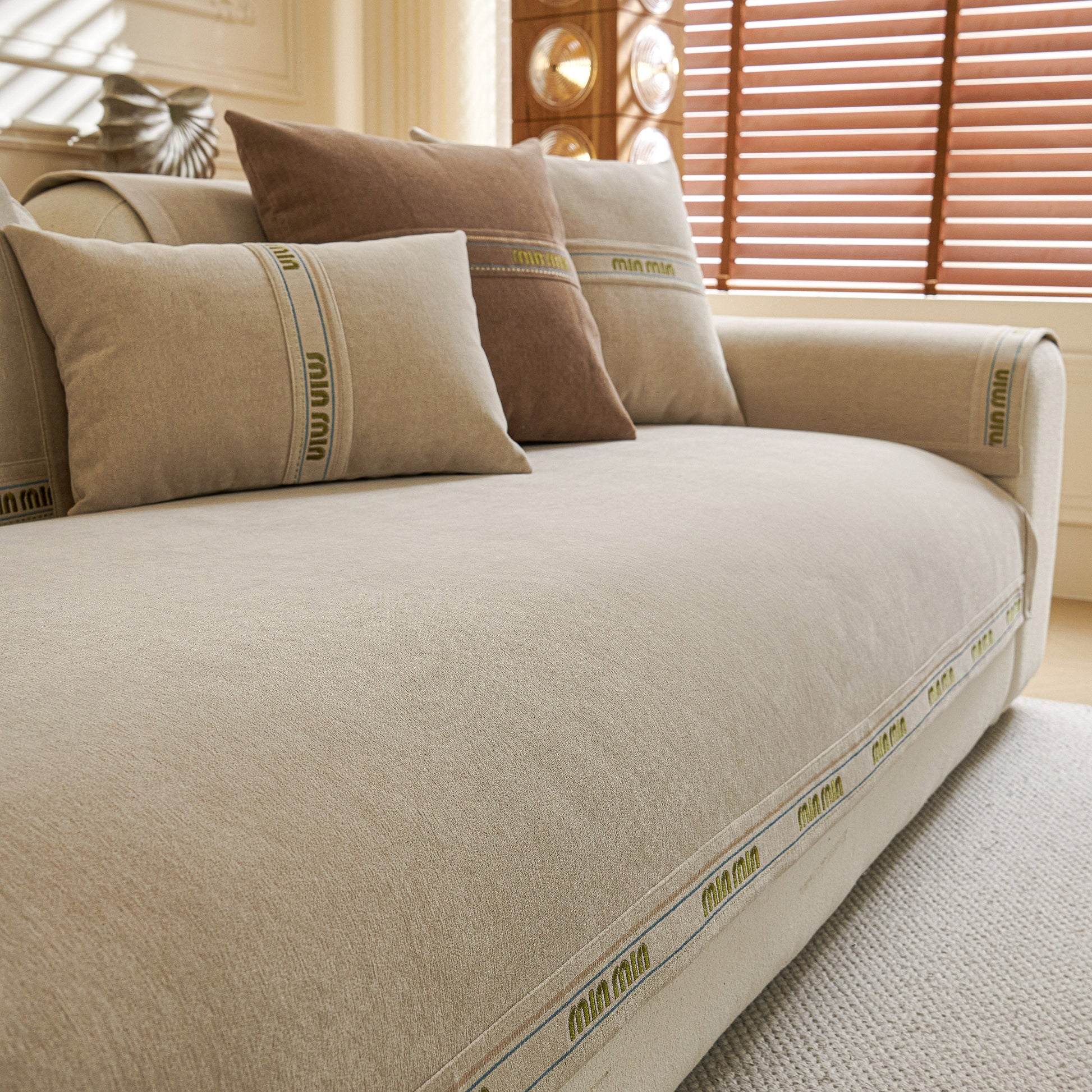 Chenille Sofa Cover Pet Mat, Non-Slip Couch Protector for Sectional & L-Shaped Sofas in neutral tones on a living room sofa.