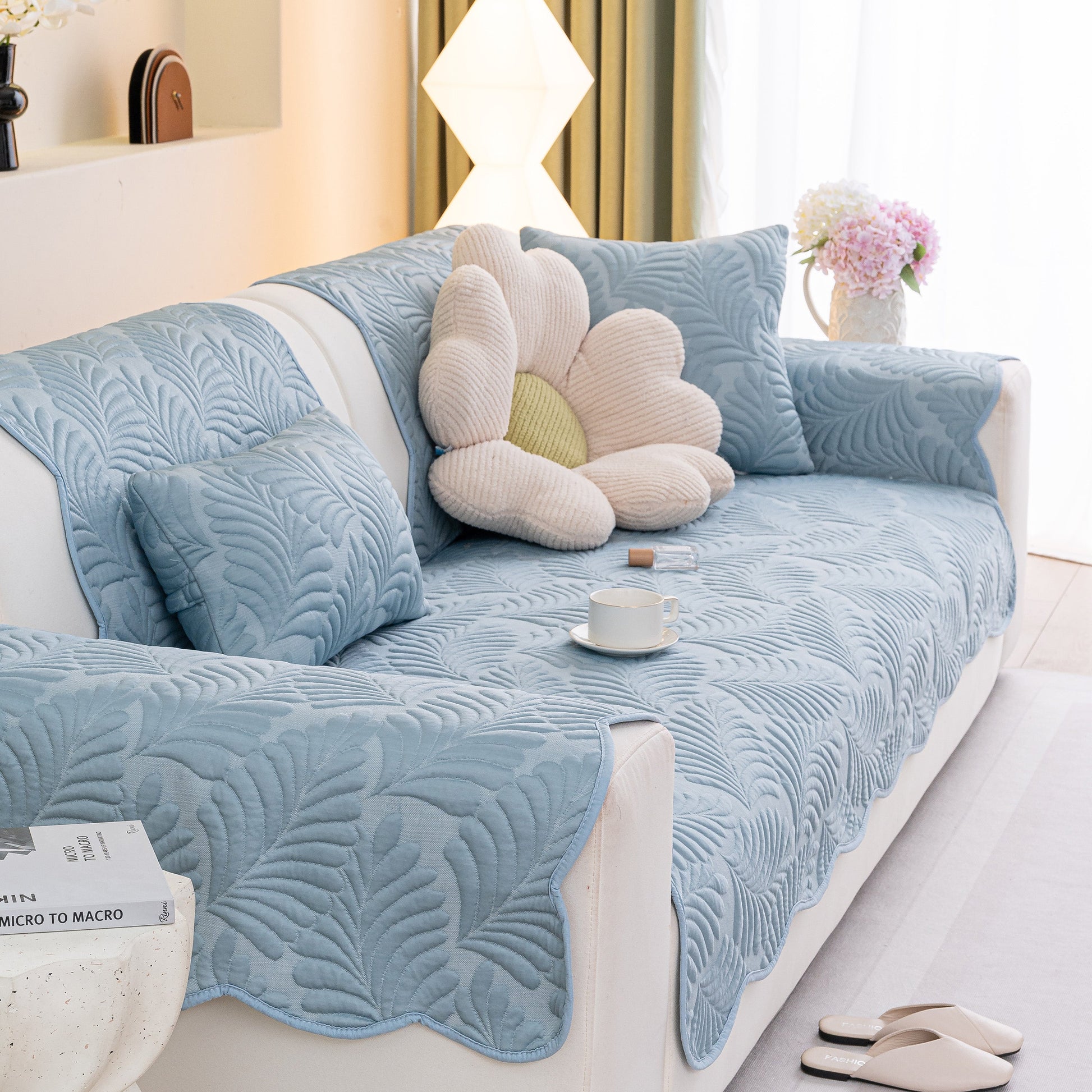 Sofa Cover for Leather & Fabric Couches, 3D Leaf Embossed Quilted Furniture Covers on a couch with pillows and decor.