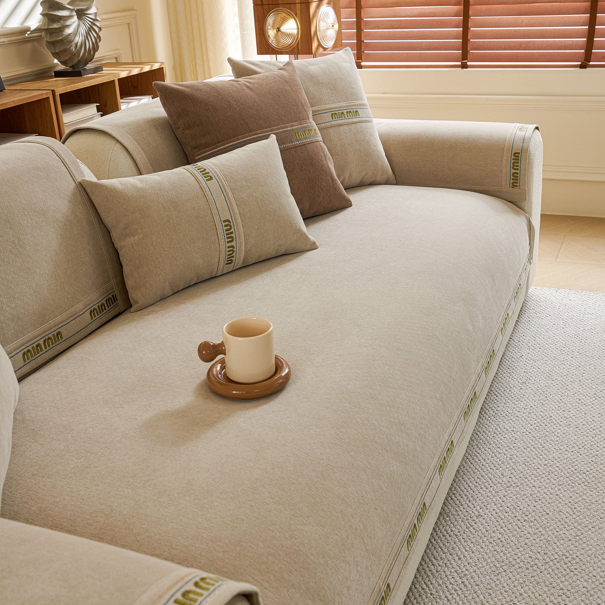 Chenille Sofa Cover Pet Mat, Non-Slip Couch Protector for Sectional & L-Shaped Sofas showcased in a living room setting with pillows.