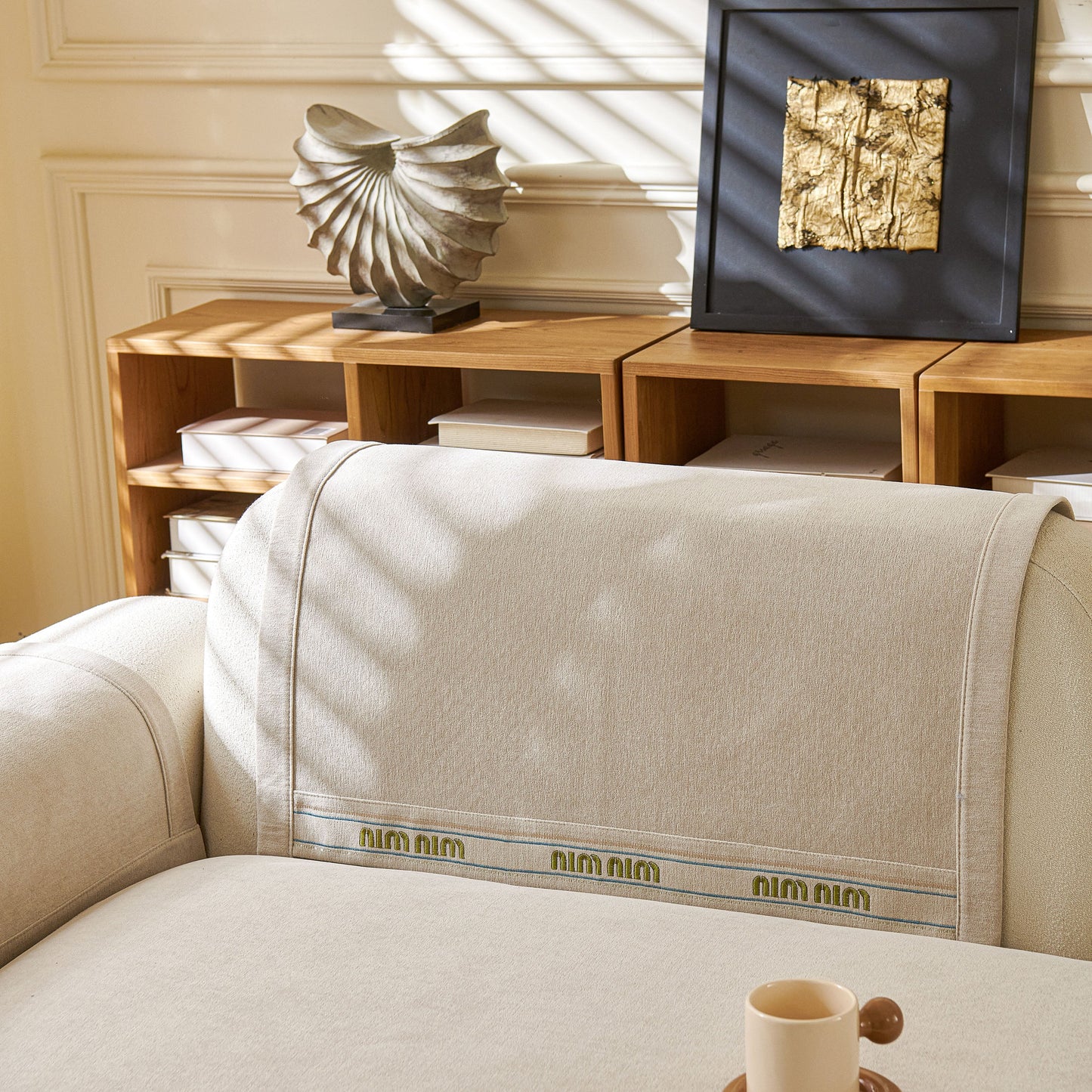 Beige Chenille Sofa Cover Pet Mat on L-shaped sofa, showcasing non-slip couch protector with neutral tones and textured design.