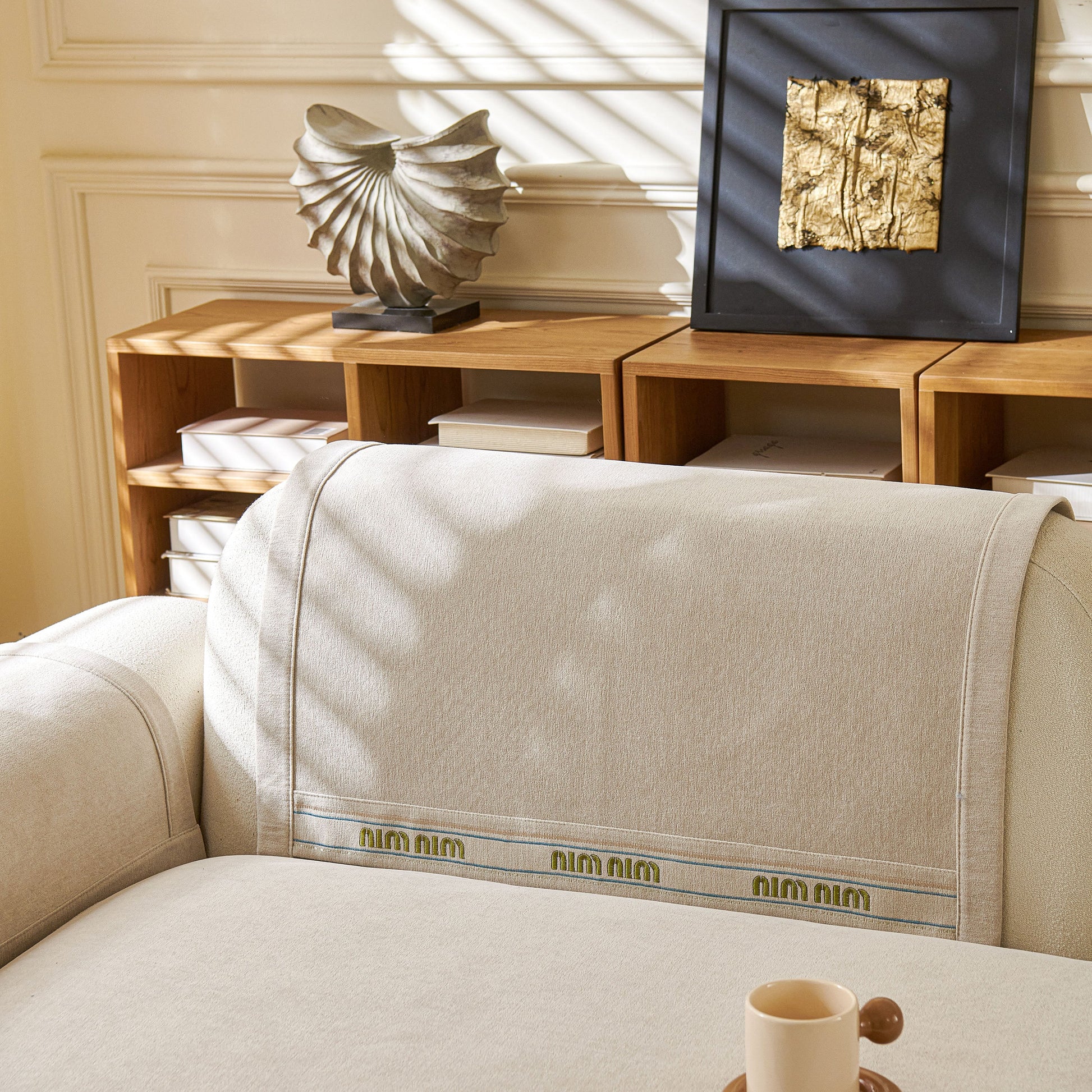 Beige Chenille Sofa Cover Pet Mat on L-shaped sofa, showcasing non-slip couch protector with neutral tones and textured design.