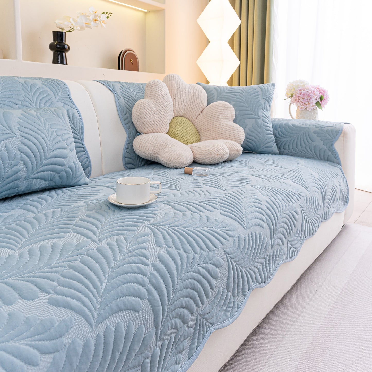 Sofa Cover for Leather & Fabric Couches, 3D Leaf Embossed Quilted Furniture Covers with anti-slip backing and wave-cut edge design.
