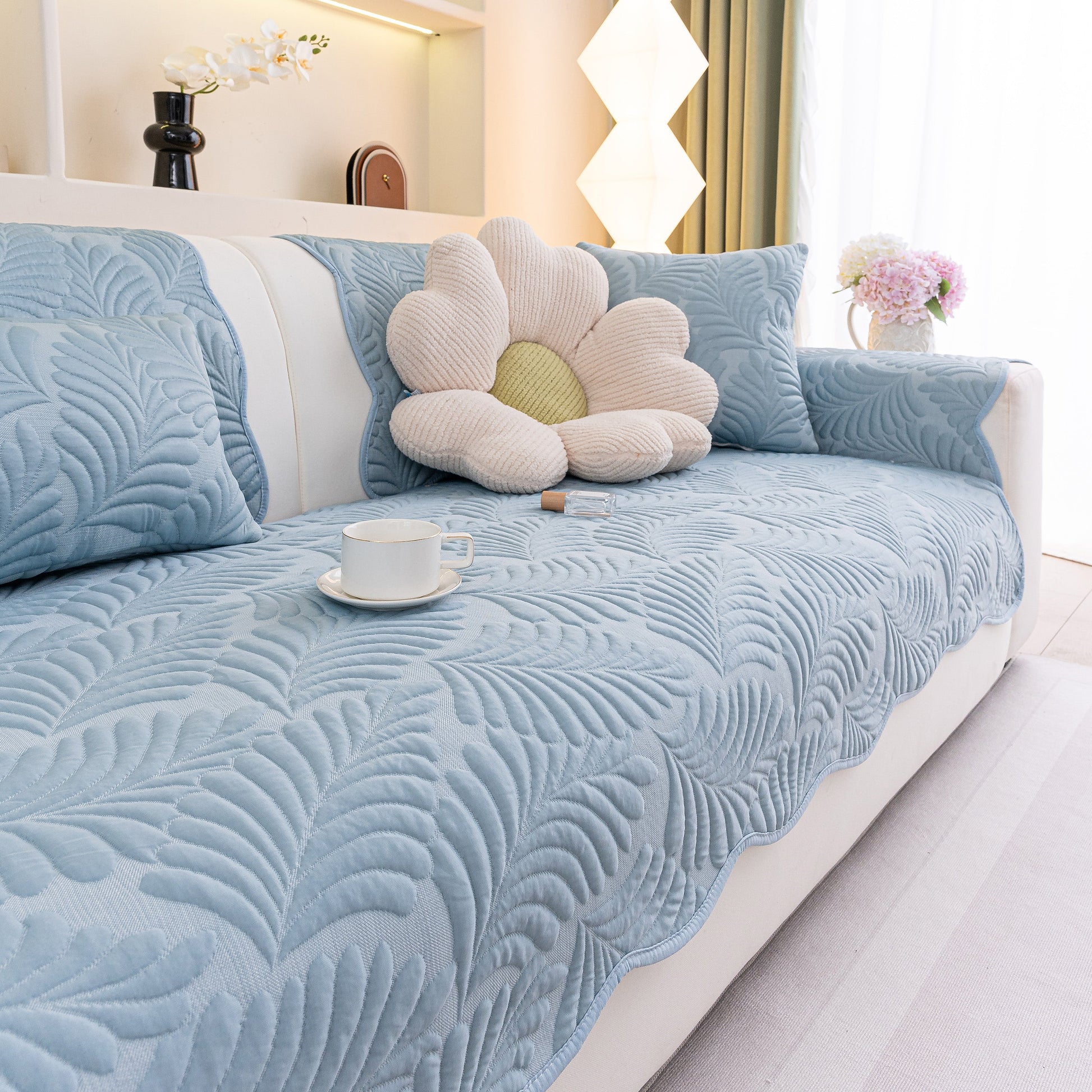 Sofa Cover for Leather & Fabric Couches, 3D Leaf Embossed Quilted Furniture Covers with anti-slip backing and wave-cut edge design.