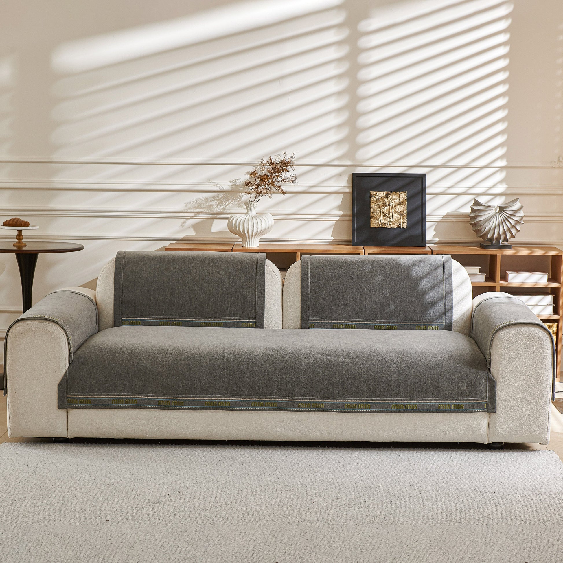 Chenille Sofa Cover Pet Mat, Non-Slip Couch Protector for Sectional & L-Shaped Sofas on a modern white couch.