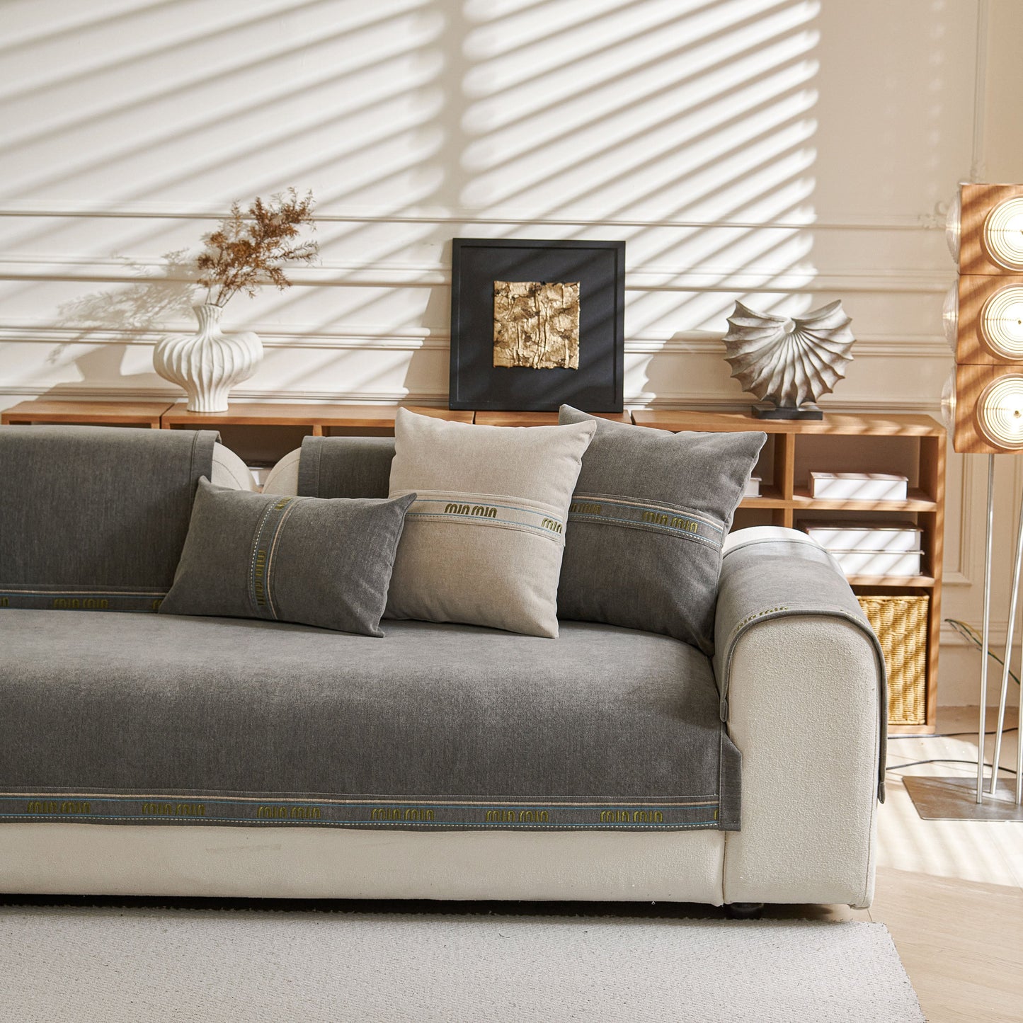 Chenille Sofa Cover Pet Mat on grey couch, Non-Slip Couch Protector for Sectional & L-Shaped Sofas with decorative pillows.